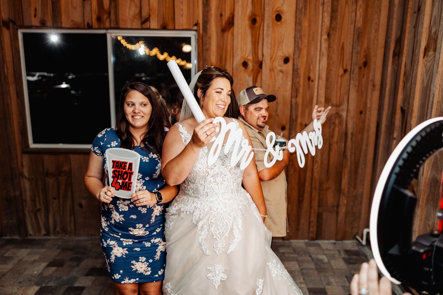 Wedding celebration with party decor and festive moments in wooden barn venue.