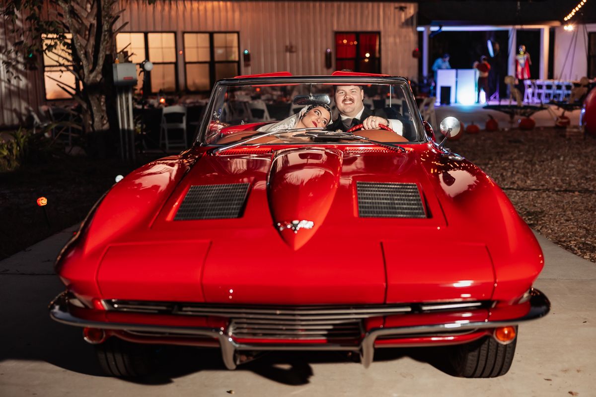 A bright red vintage Chevrolet Corvette Stingray sports car photographed from multiple angles in a nighttime setting.