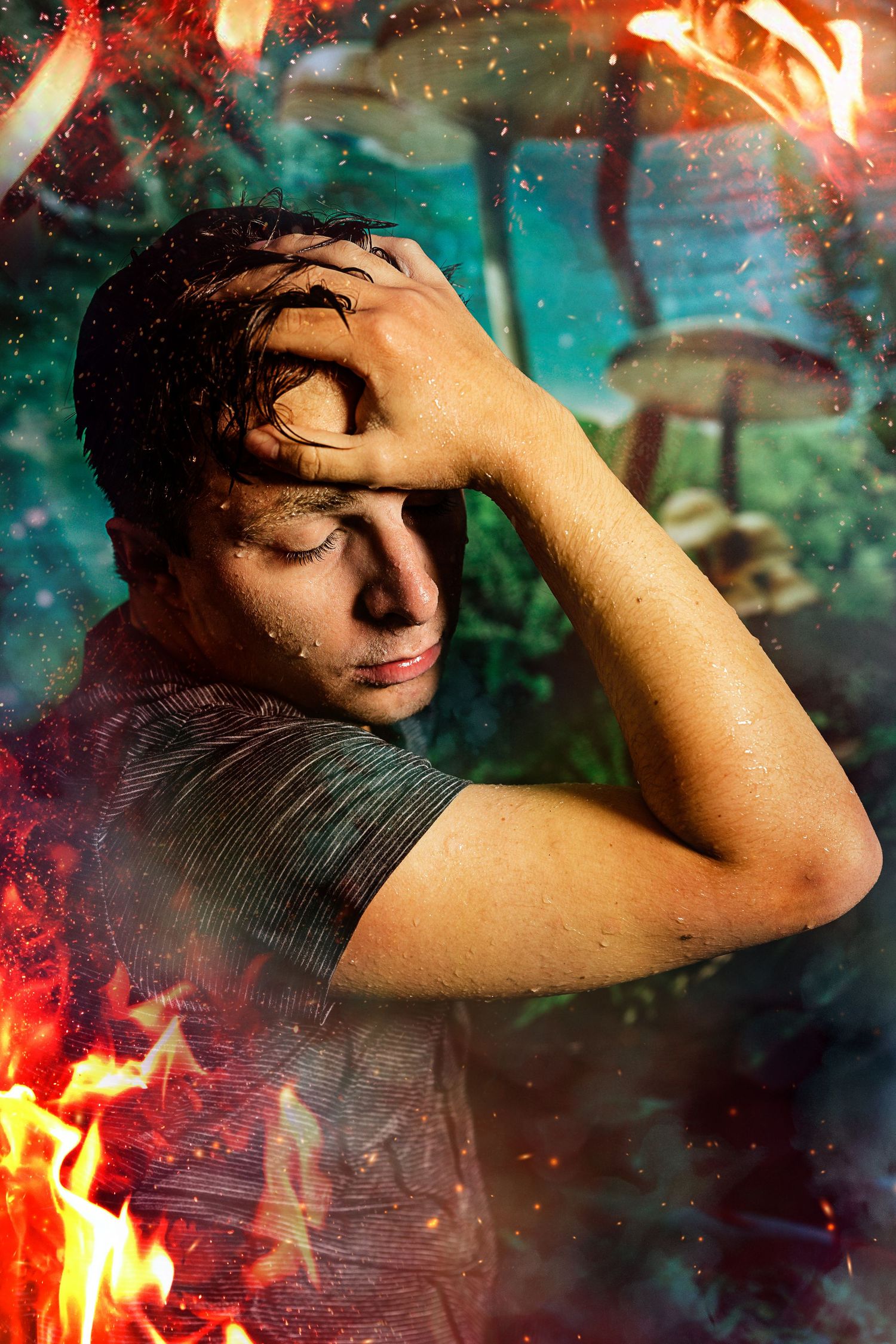 Young man with wet hair surrounded by fire and sparks in dark fantasy forest composite photo.