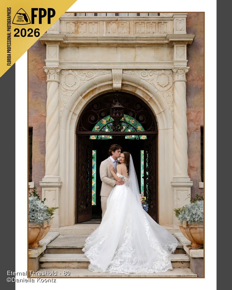 FPP 2026 award-winning photo of bride and groom kissing at an ornate stone church entrance doorway.