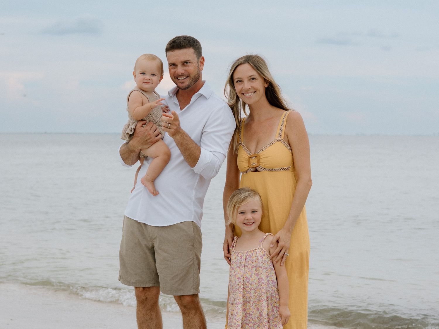 Family walking along Fort De Soto Beach during a St. Petersburg family photography session.