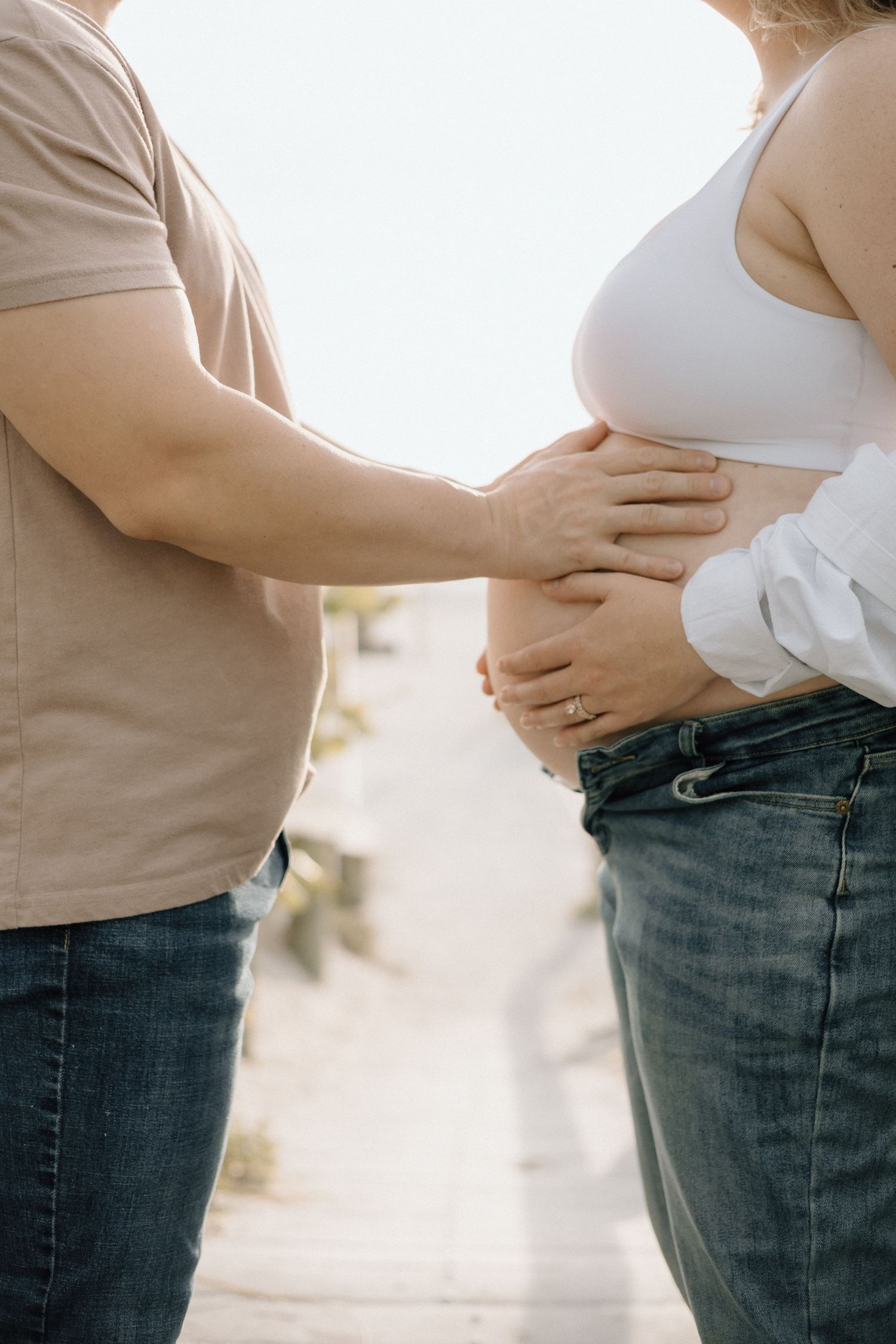 couple first child on the way, maternity session, golden hour on the beach near don cesar pass-a-grille