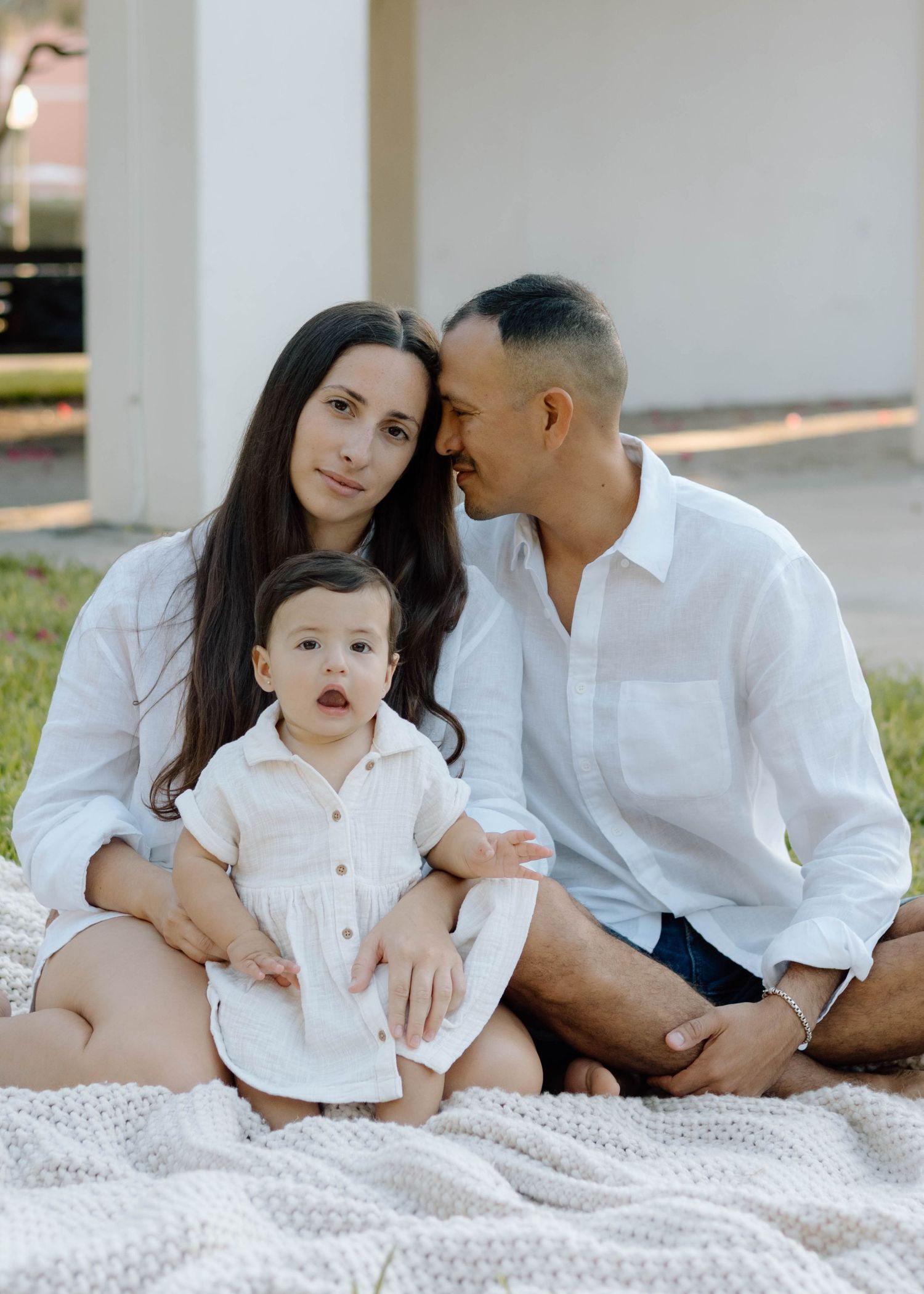 couple and family session taking candid natural style family photos while downtown st.petersburg near north straub park