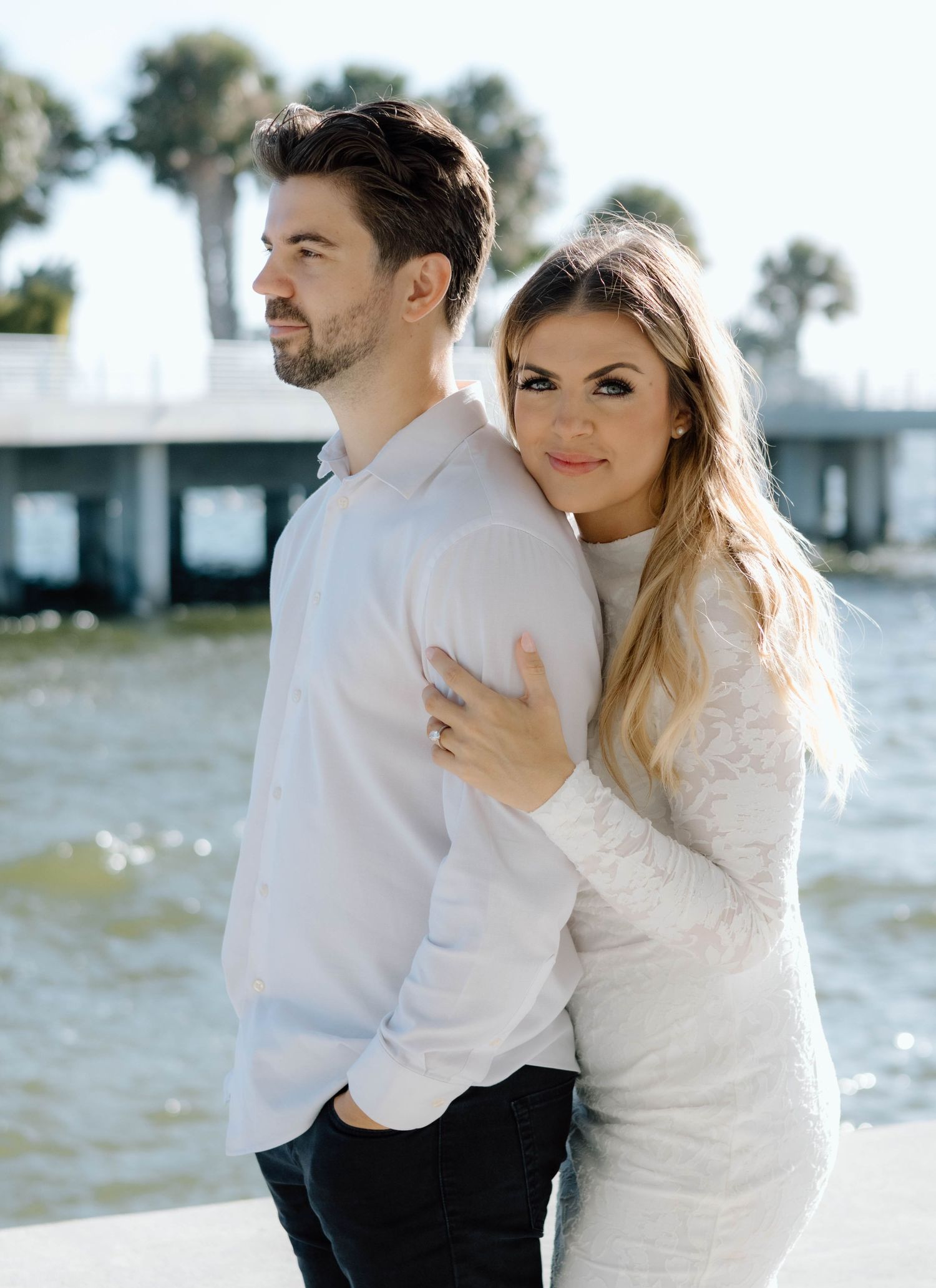 Couple exploring downtown St. Petersburg during a candid engagement session.