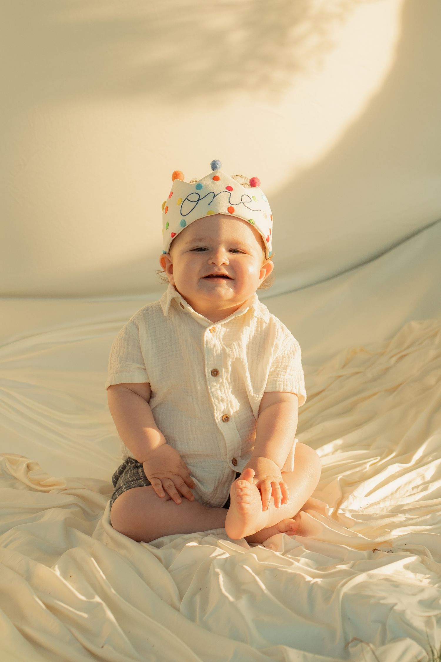 Smiling baby wearing a colorful 