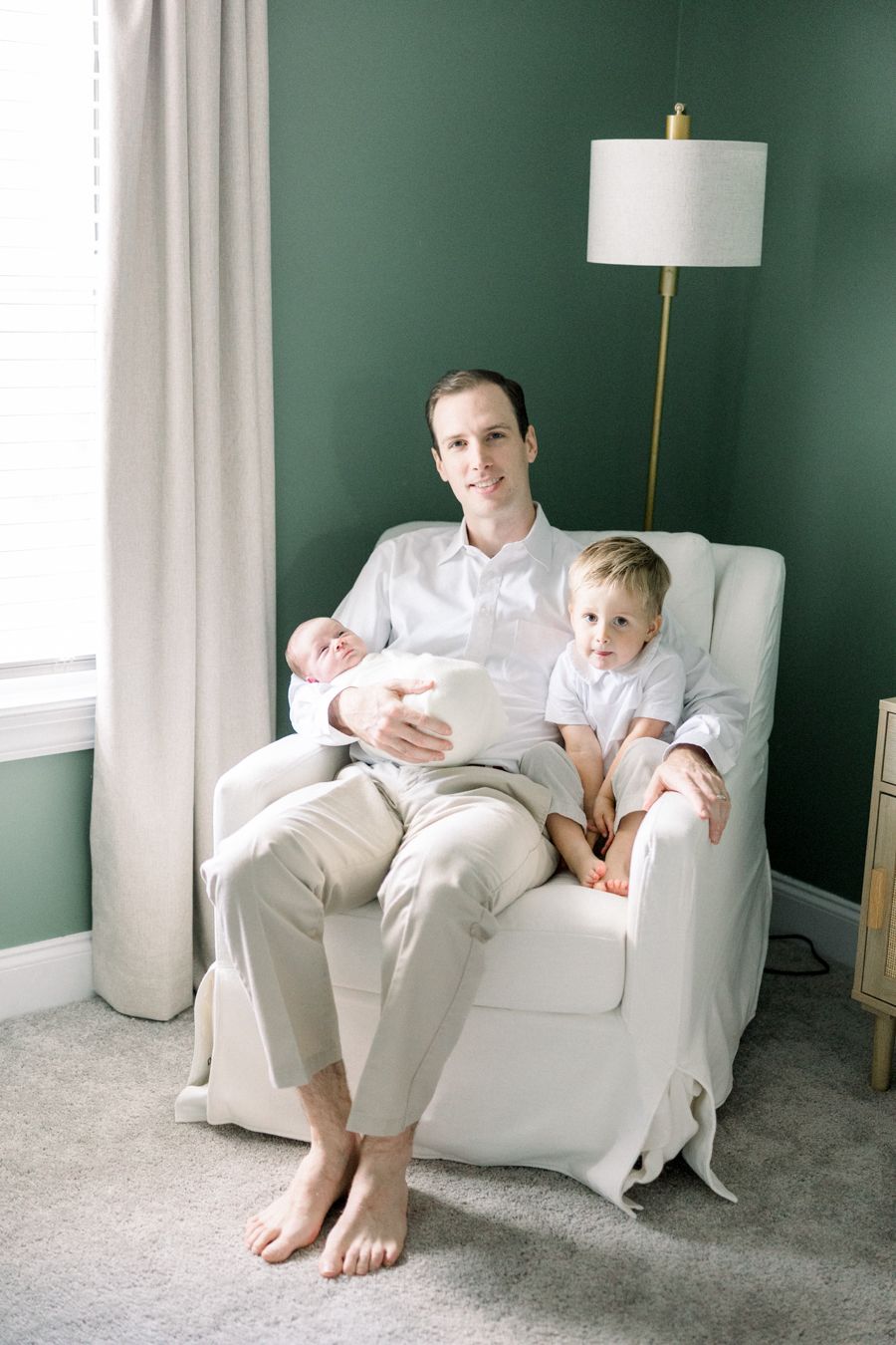 Baby-led newborn photography moment at home in Augusta, Georgia