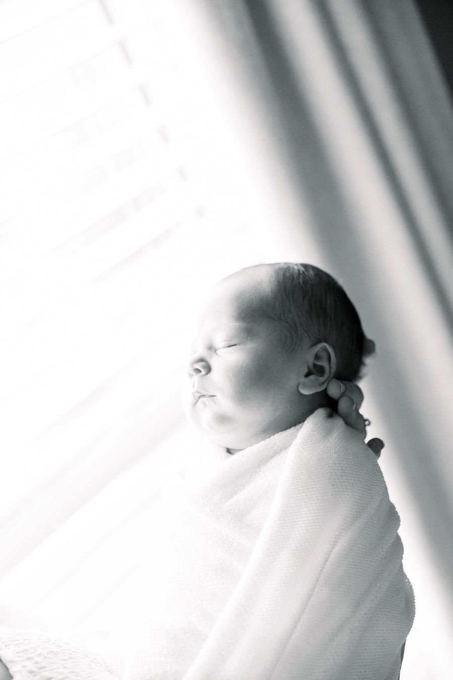 Cozy in-home newborn session with parents and baby in Augusta, Georgia