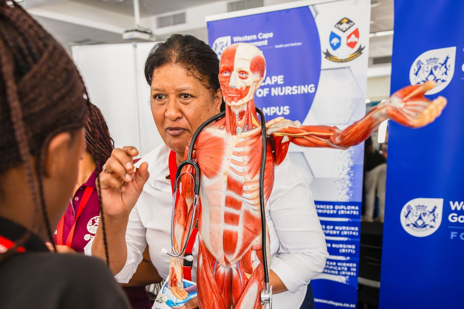 Educational presentation featuring anatomical model in classroom setting.