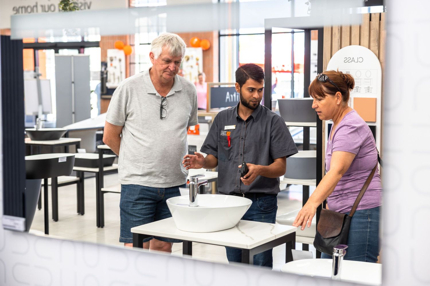 People gathering in a modern cafeteria or break room space.