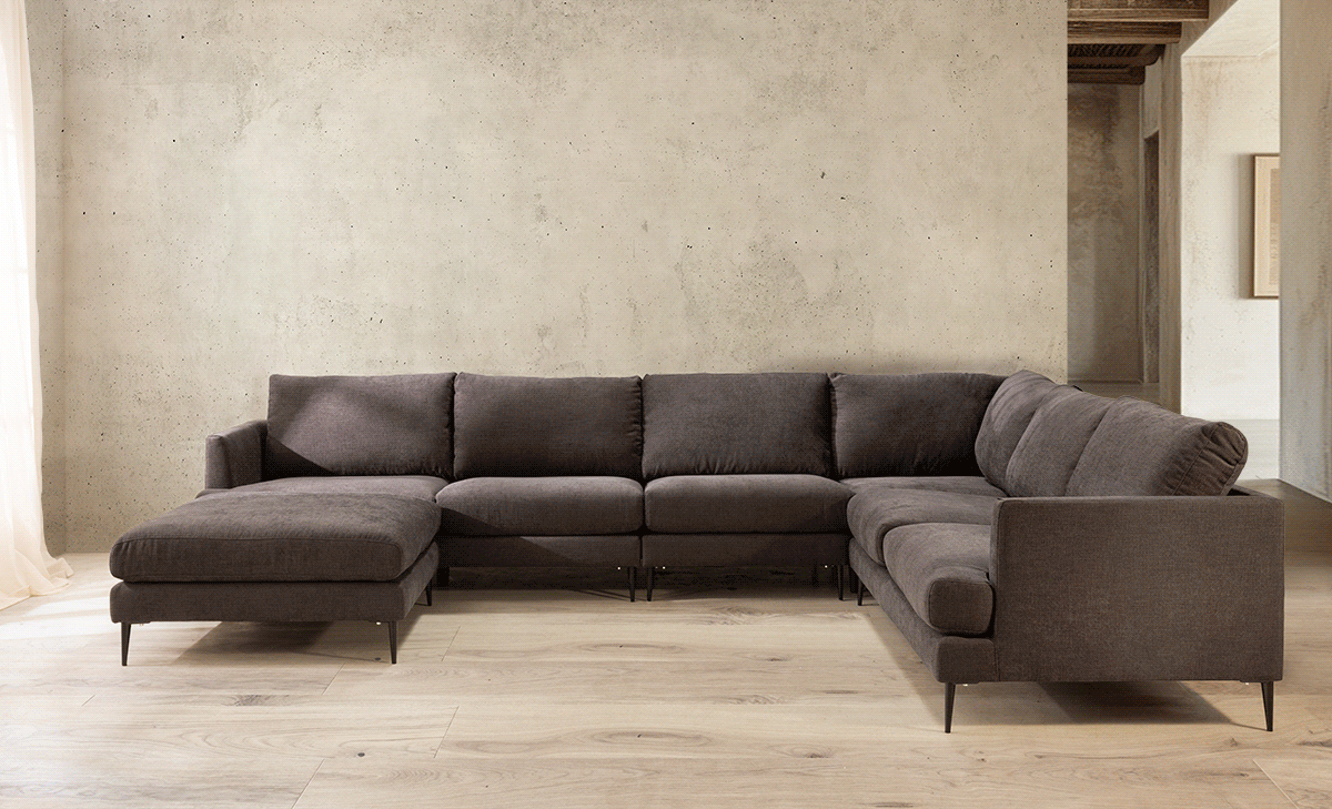 Contemporary gray sectional sofa arrangement in a minimalist living room setting.