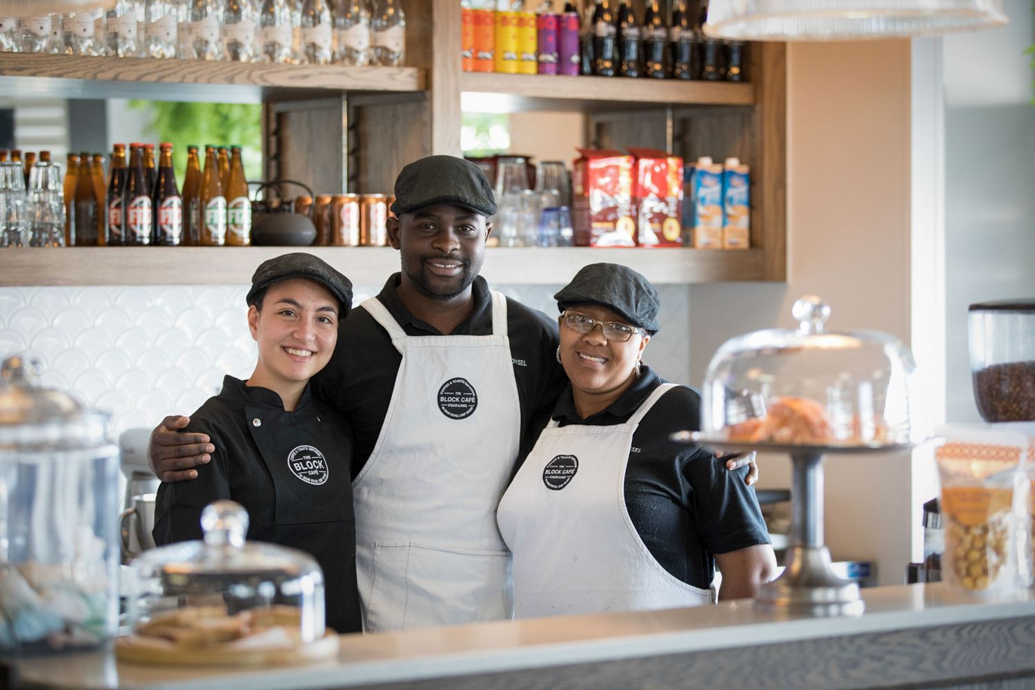 Staff members working behind the counter at The Block Cafe.