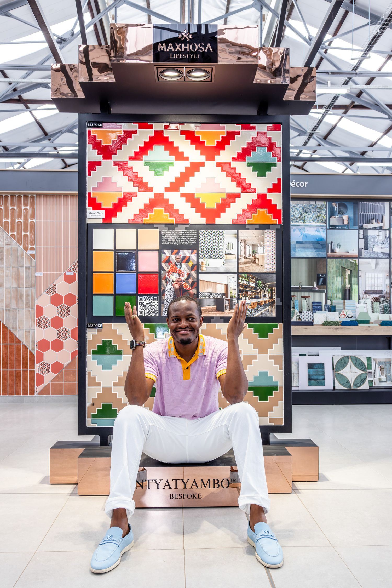 A retail storefront with a colorful geometric patterned display board and modern interior design elements.