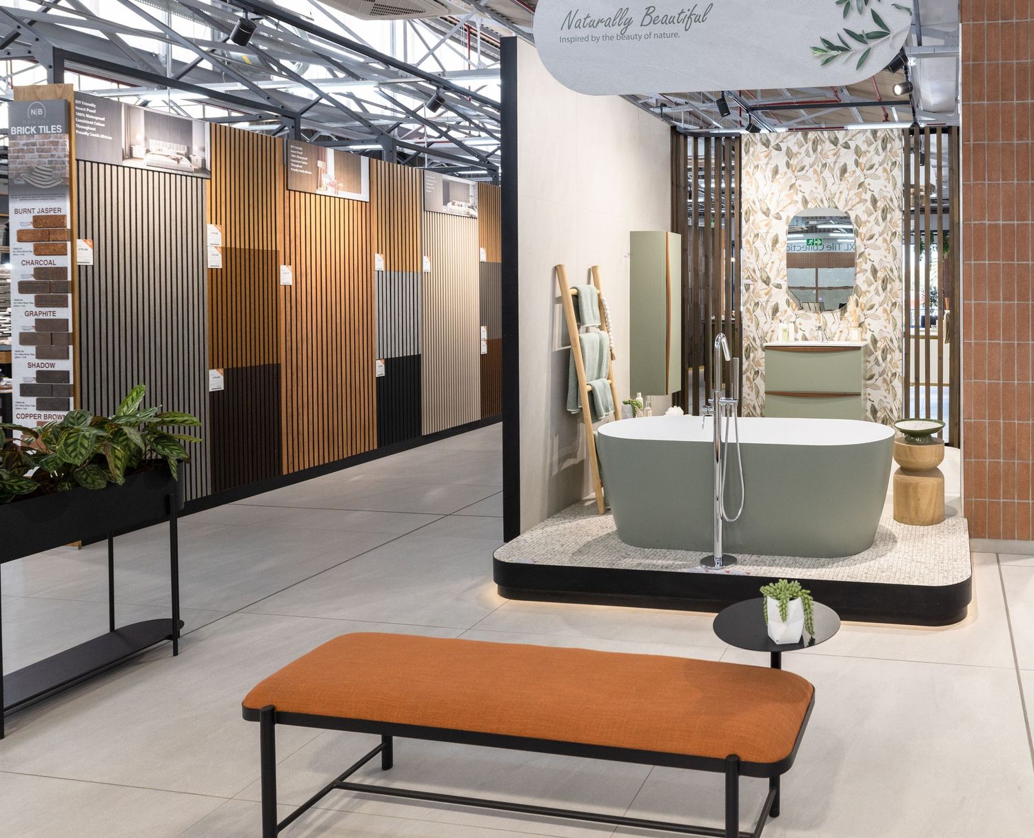 Sleek retail showroom space with glass partitions, wooden fixtures and bright lighting.