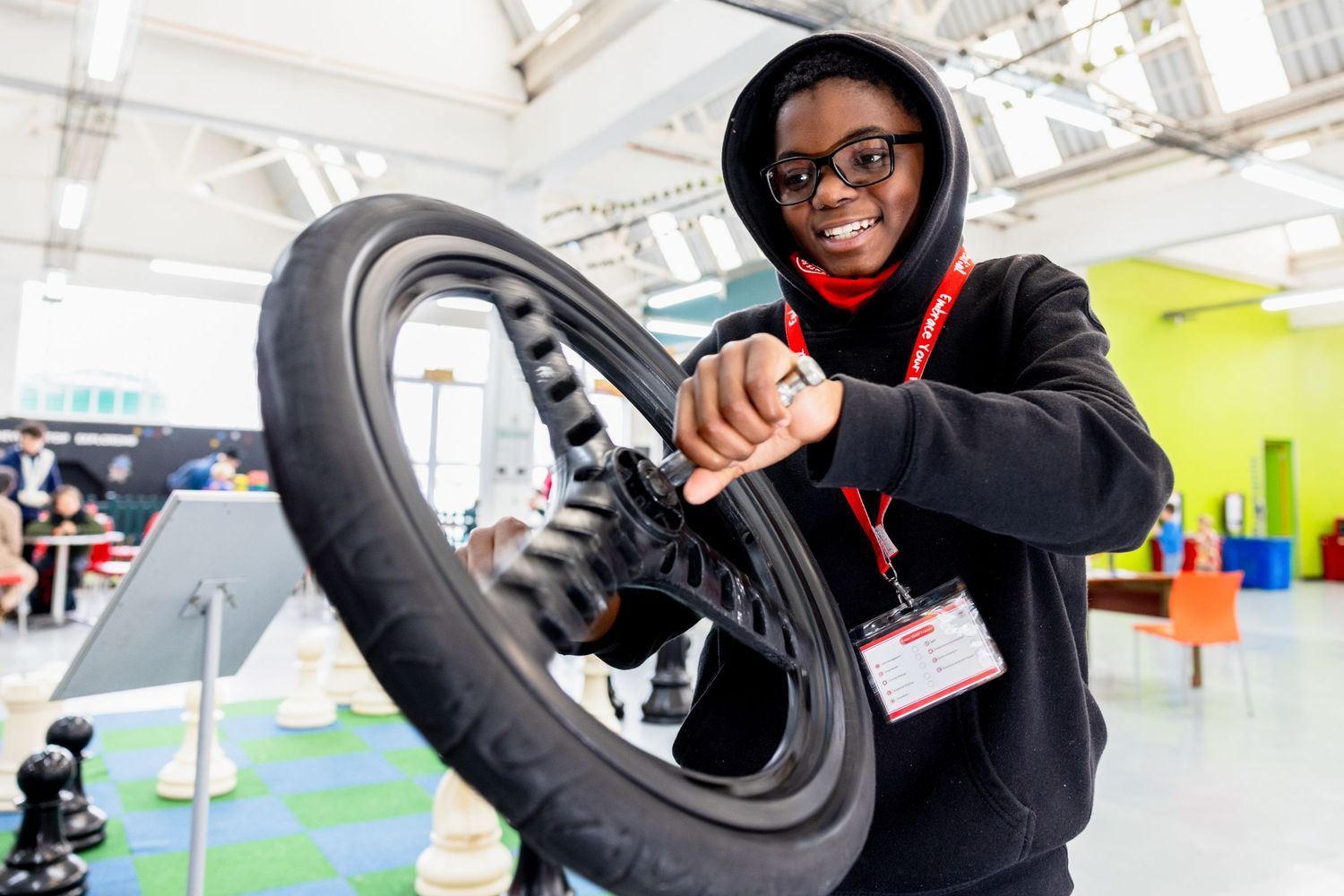 Students explore mechanical and engineering concepts through hands-on experiments.