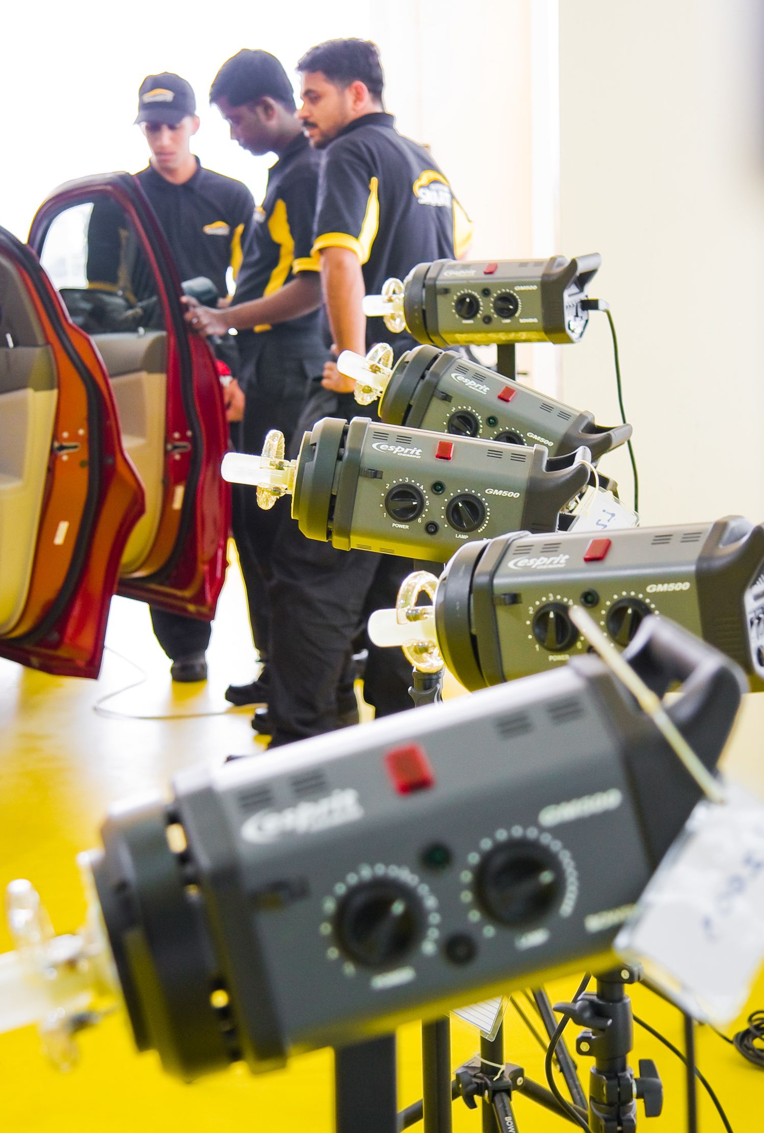 Technical equipment and cameras set up for automotive inspection or testing.