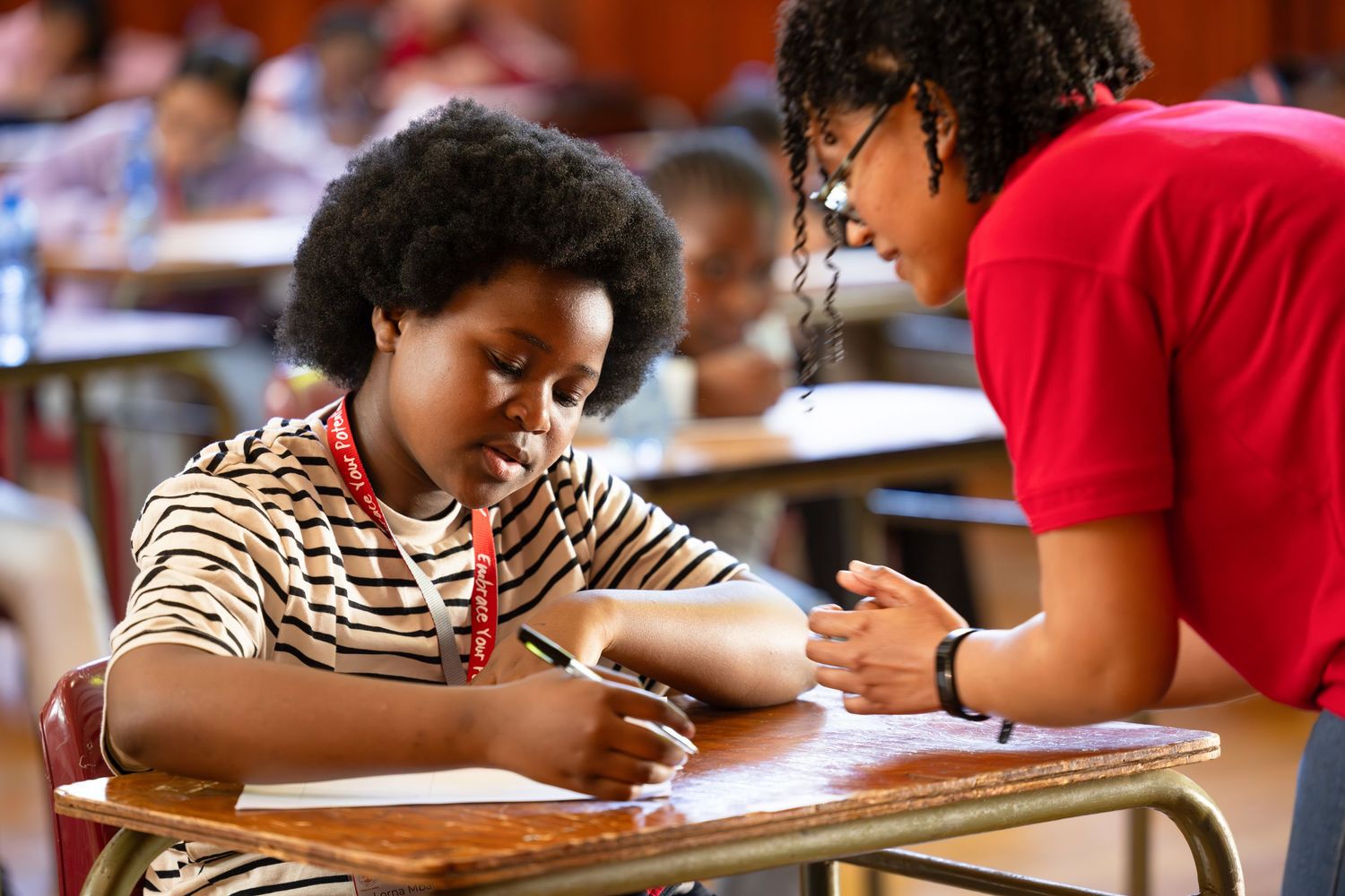 Students working independently at their desks during a classroom session.