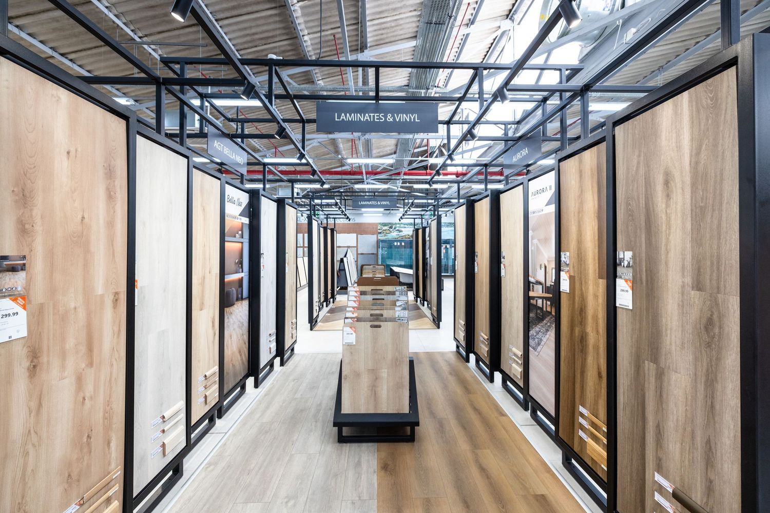 Long corridor with wooden walls and glass panels showcasing retail or office spaces.