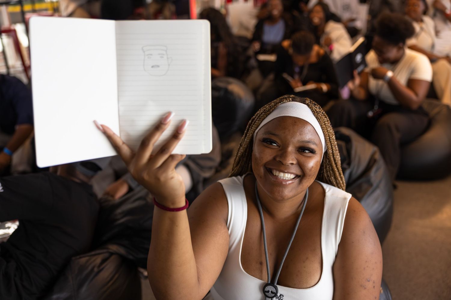 Students taking notes and participating in an educational workshop session.