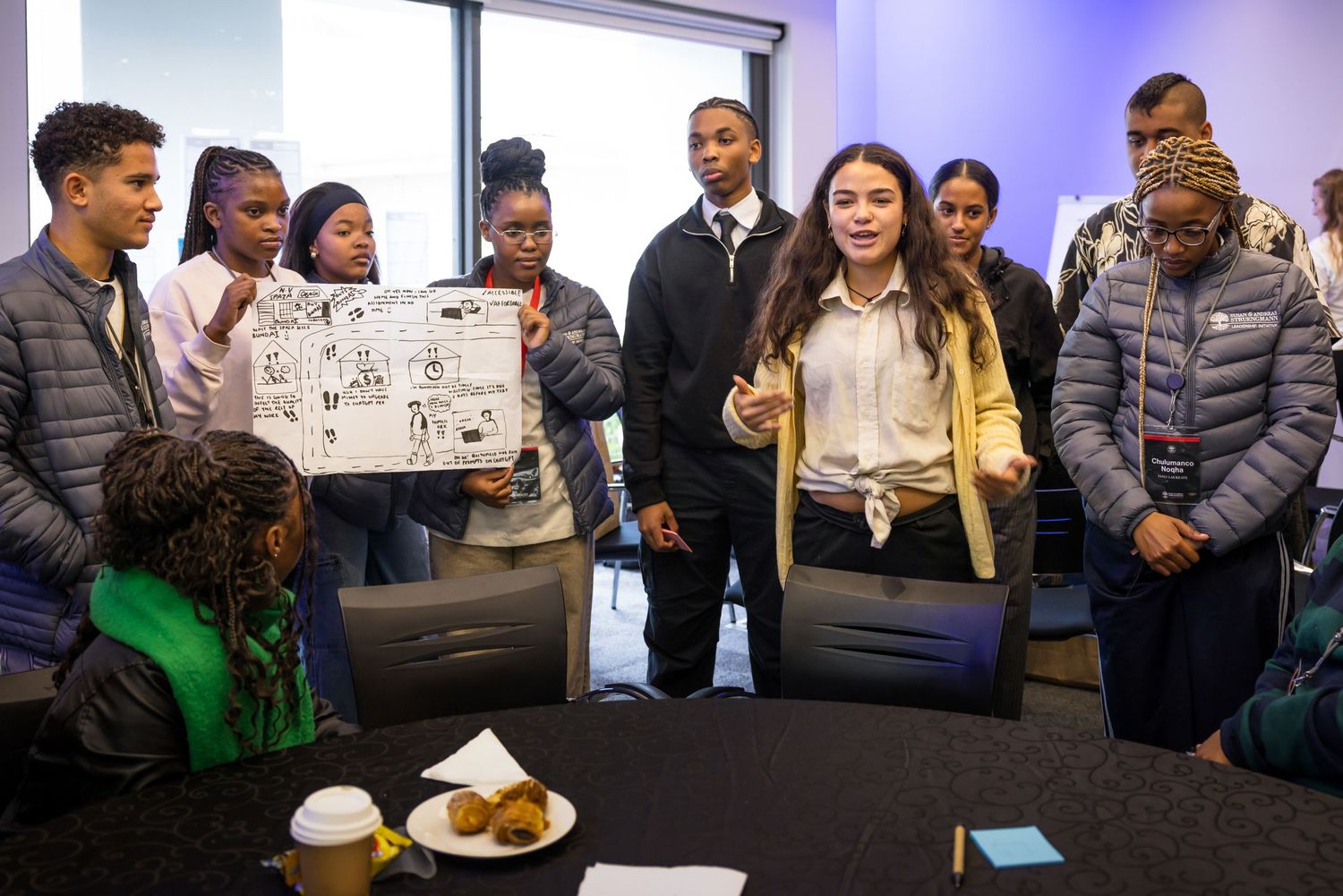 Workshop participants gather to share and display their completed projects.