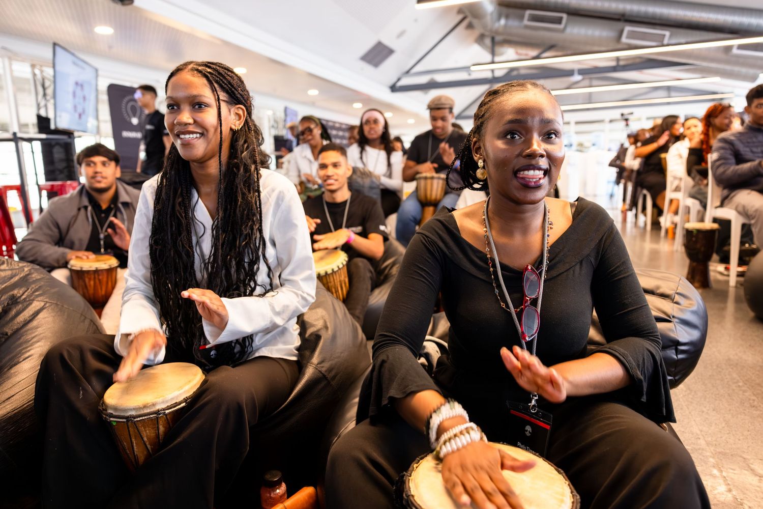 Participants enjoy interactive drumming session during professional development workshop.