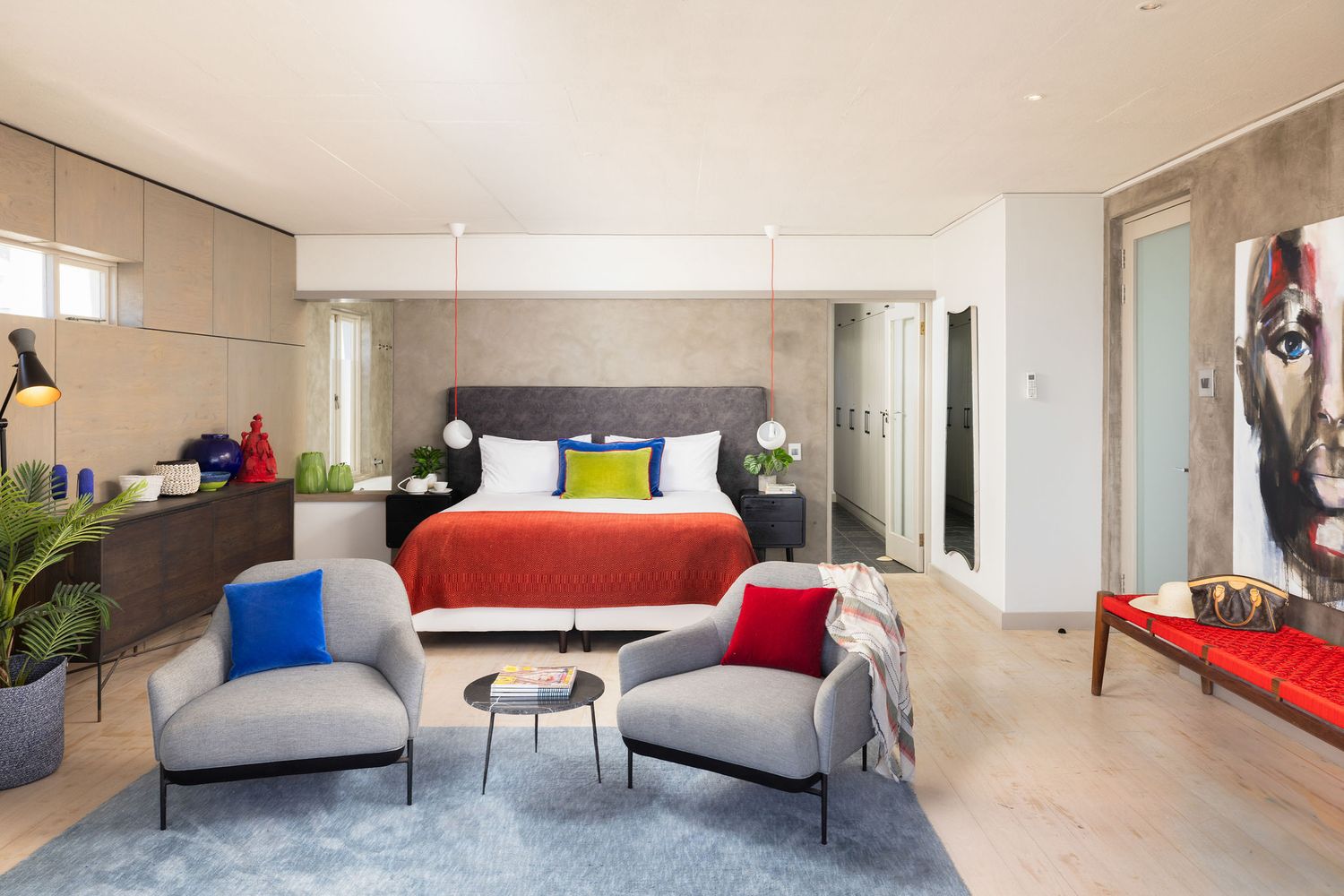 Modern minimalist interior design featuring sleek furniture and clean lines in a bright open-concept living space.