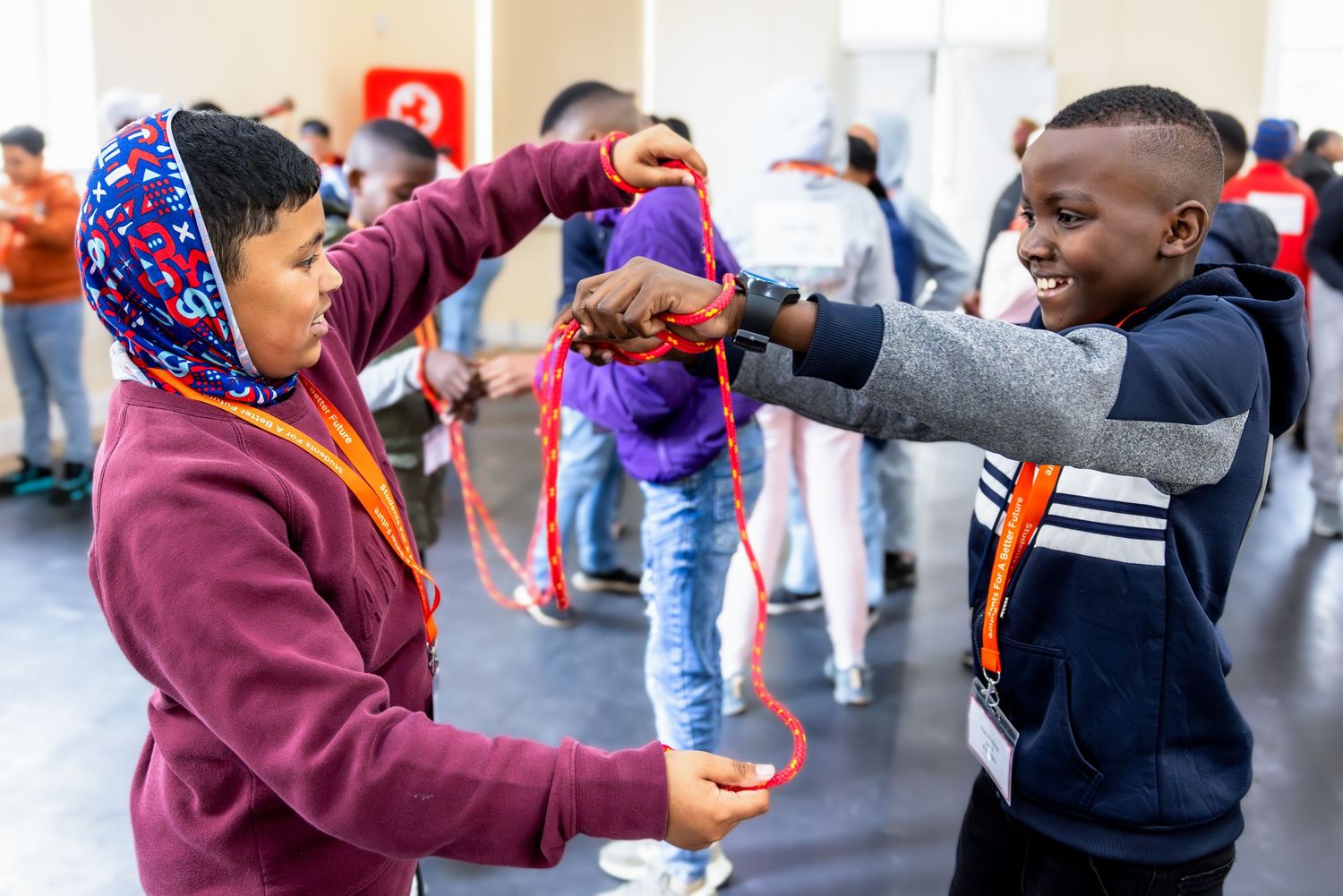 Students engage in a dynamic team-building exercise in a classroom setting.