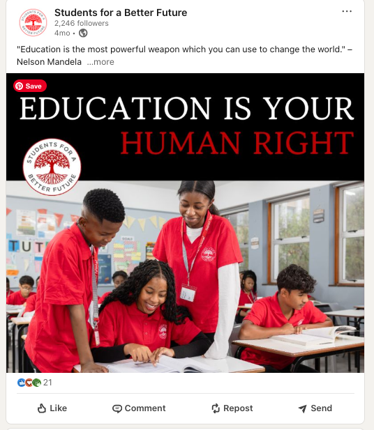 Students working together in classroom wearing red uniforms while engaging in educational activities.