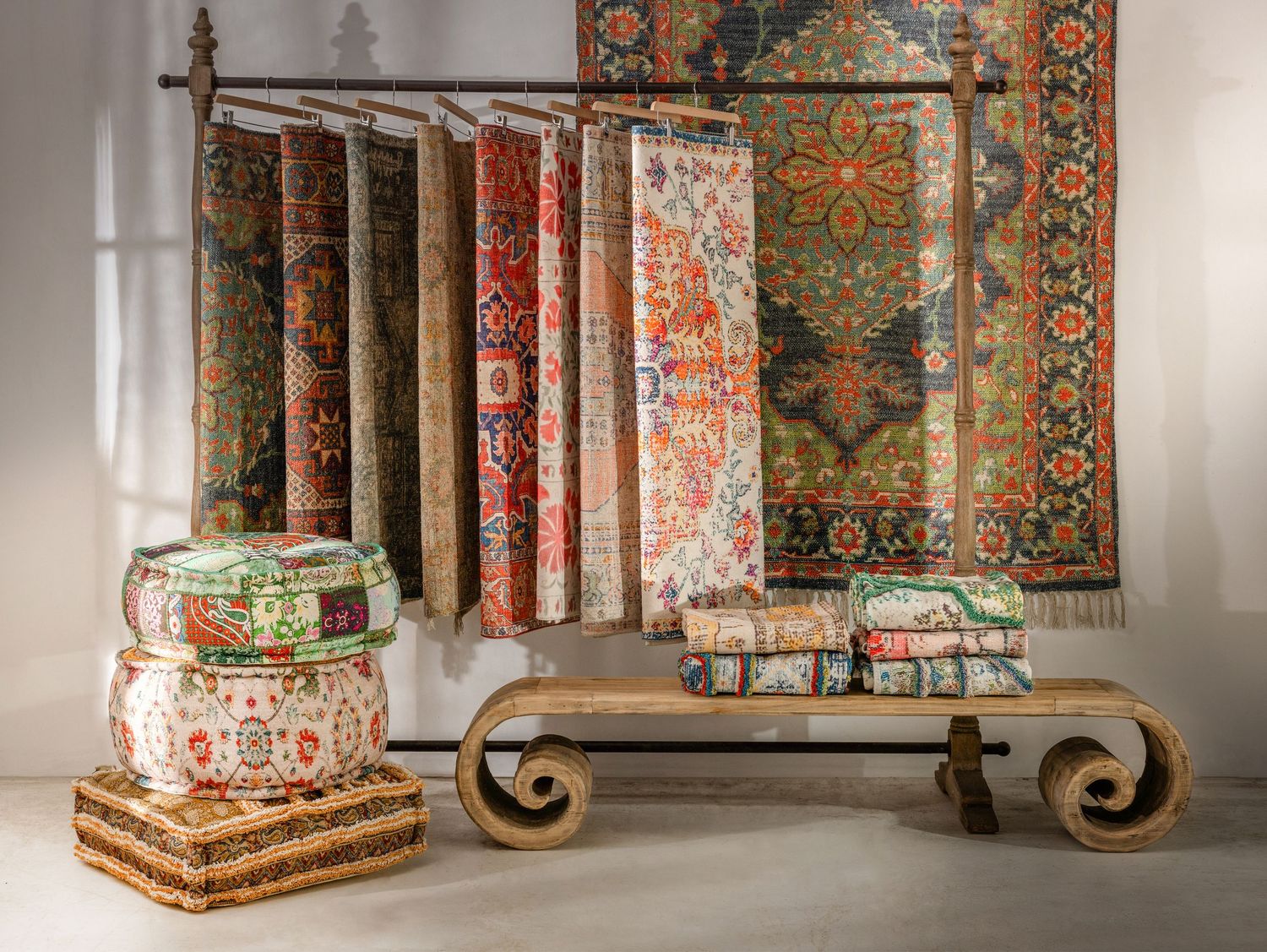 Ornate decorative pillars with intricate floral patterns and elaborate designs displayed in an interior setting.