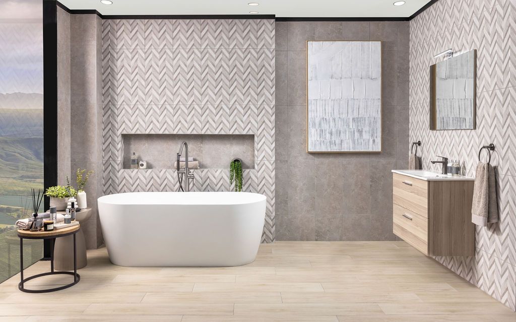 Modern luxury bathroom with freestanding tub, textured wallpaper, and panoramic mountain views through large windows.