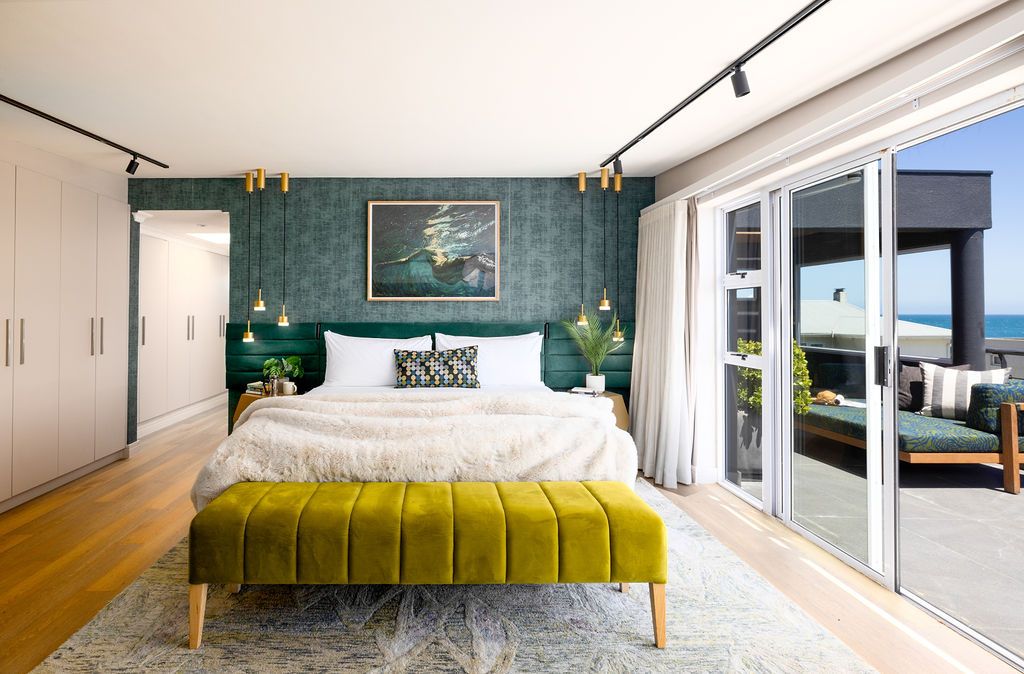 Modern minimalist bedroom interior with white walls, large windows, and yellow accents showcasing Scandinavian design style.