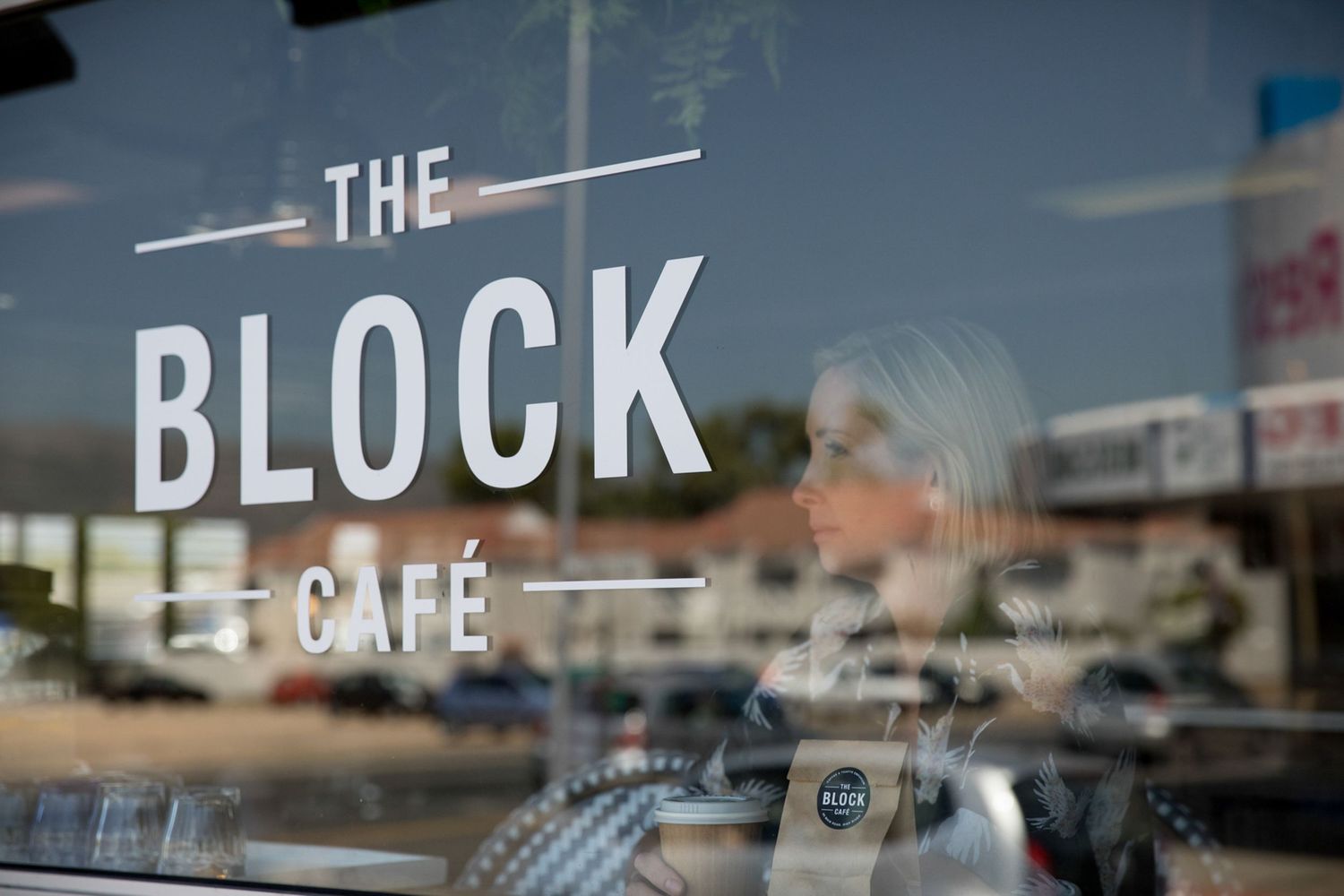 Exterior signage reading 'The Block Cafe' with modern typography.