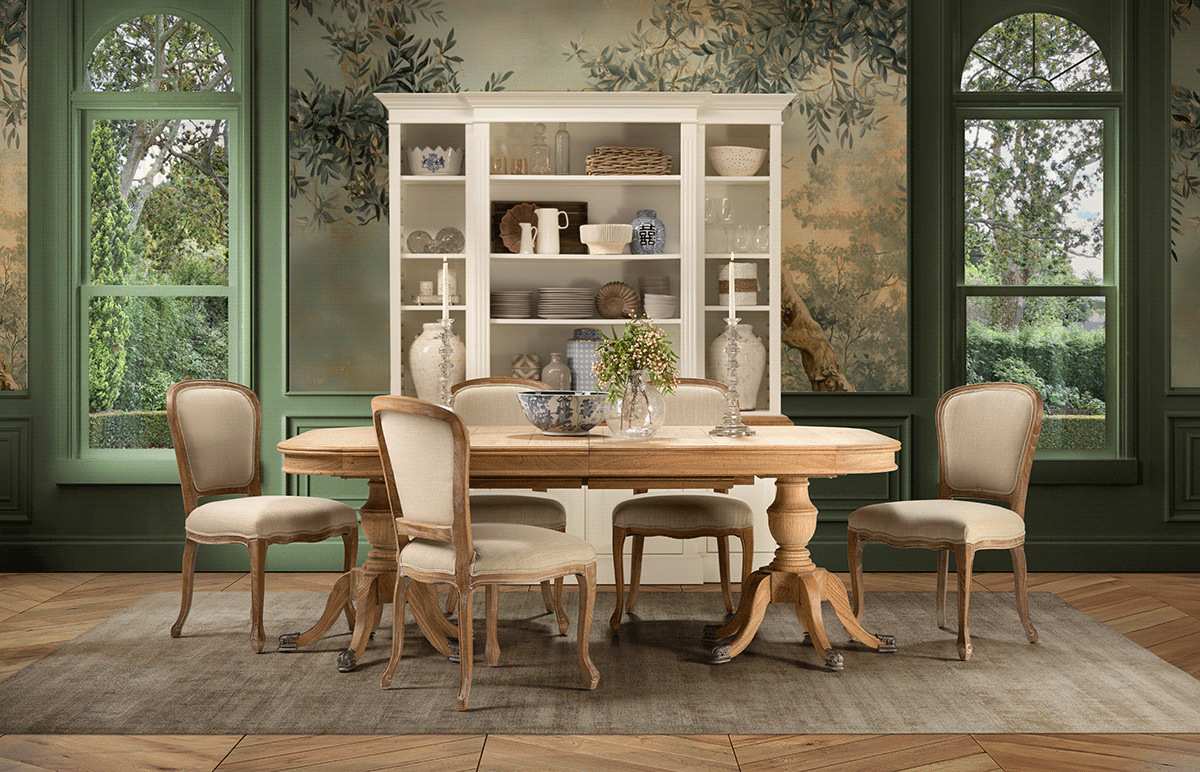 Elegant dining room with vintage furniture, white hutch and botanical wallpaper in muted green tones.