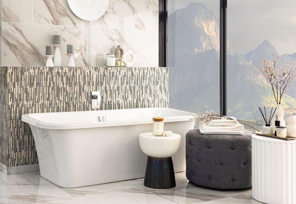 Modern bathroom design featuring textured wall panels, freestanding bathtub, and minimalist decor against mountain views.
