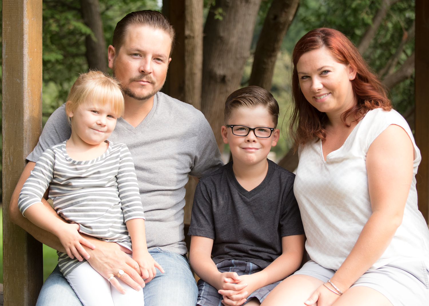A series of candid family portraits showing people sitting together outdoors against a natural backdrop.