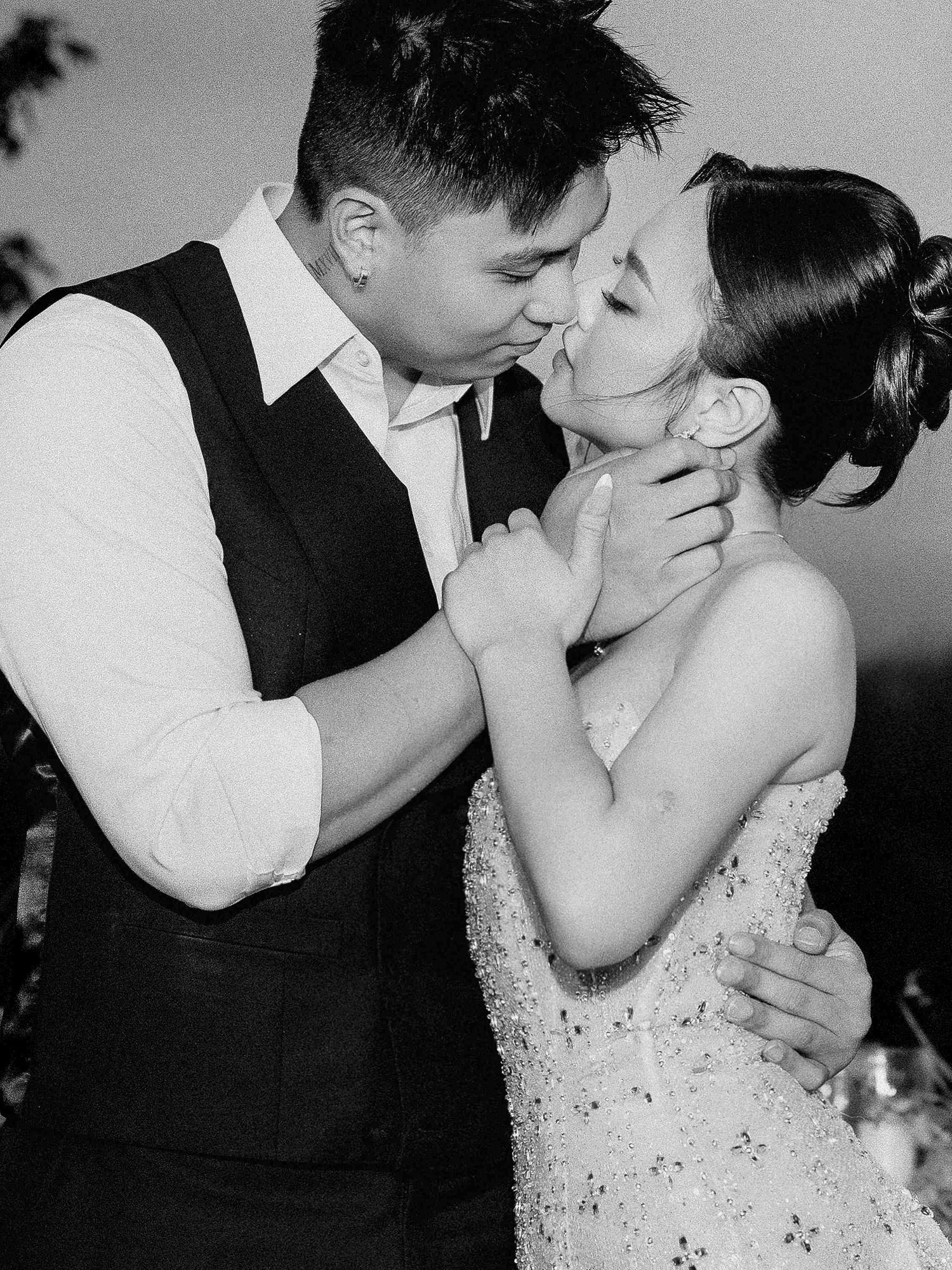 wedding: black and white wedding photos capturing tender moments between a couple in formal attire, by AnhVuWedding.