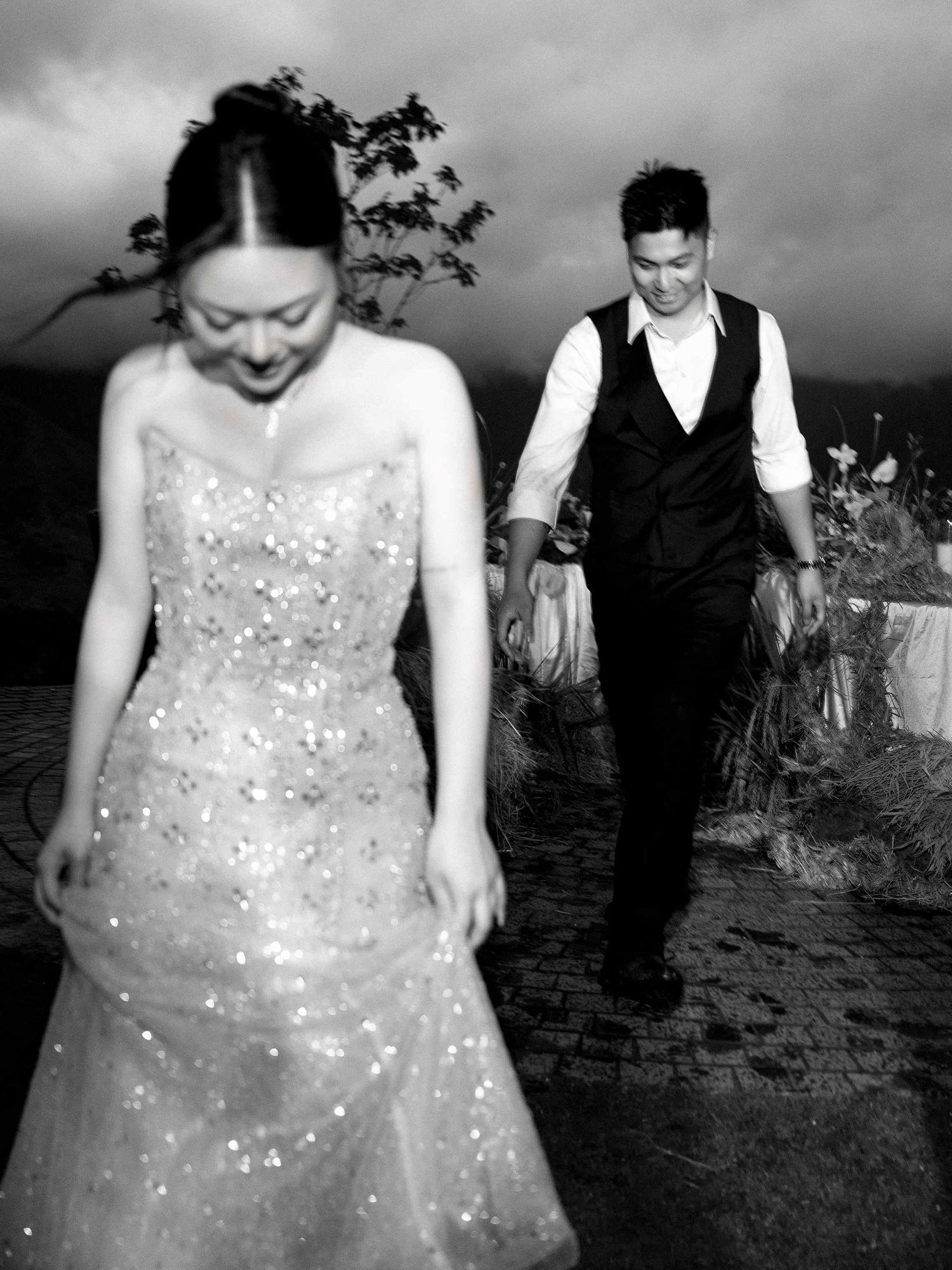 wedding: series of black and white wedding portraits showing candid moments in an outdoor setting, by AnhVuWedding.