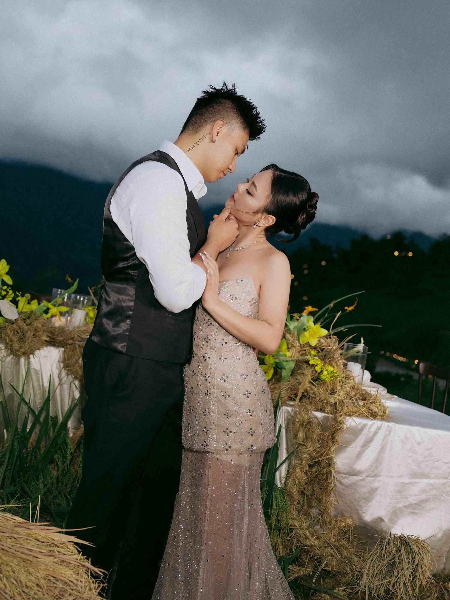 wedding: couple shares an intimate moment in formal wear, by AnhVuWedding.