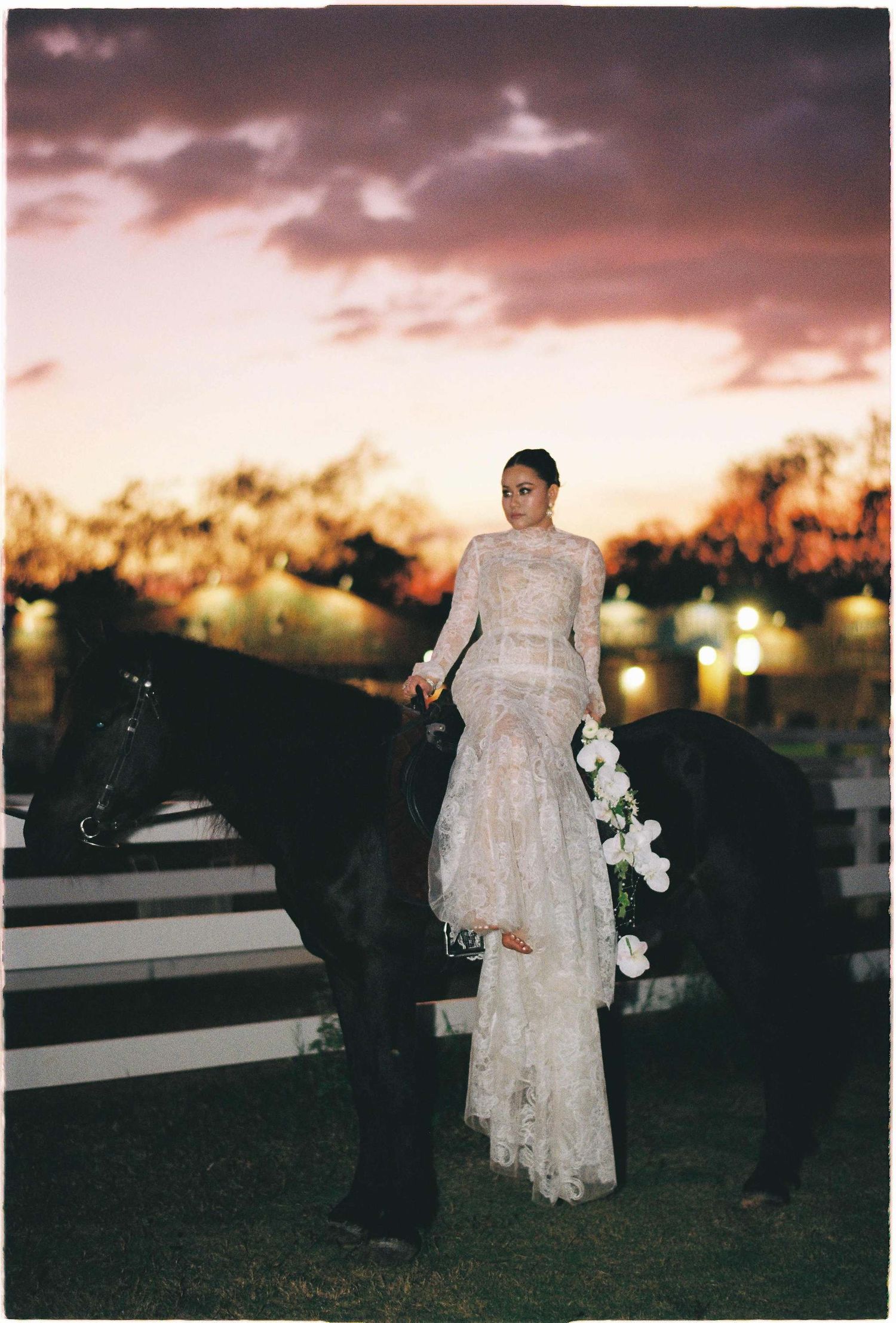 Saigon pre-wedding: white lace dress flows in the evening light beside a scenic waterfront, by AnhVuWedding.