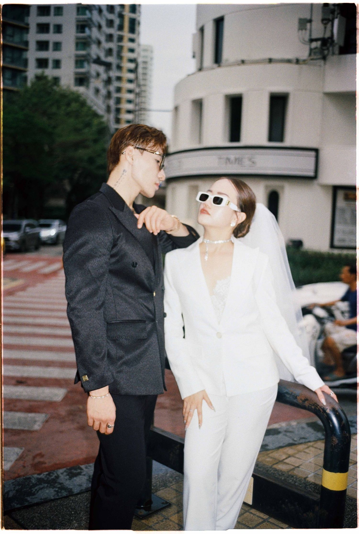 Saigon pre-wedding: stylish couple poses outdoors, by AnhVuWedding.