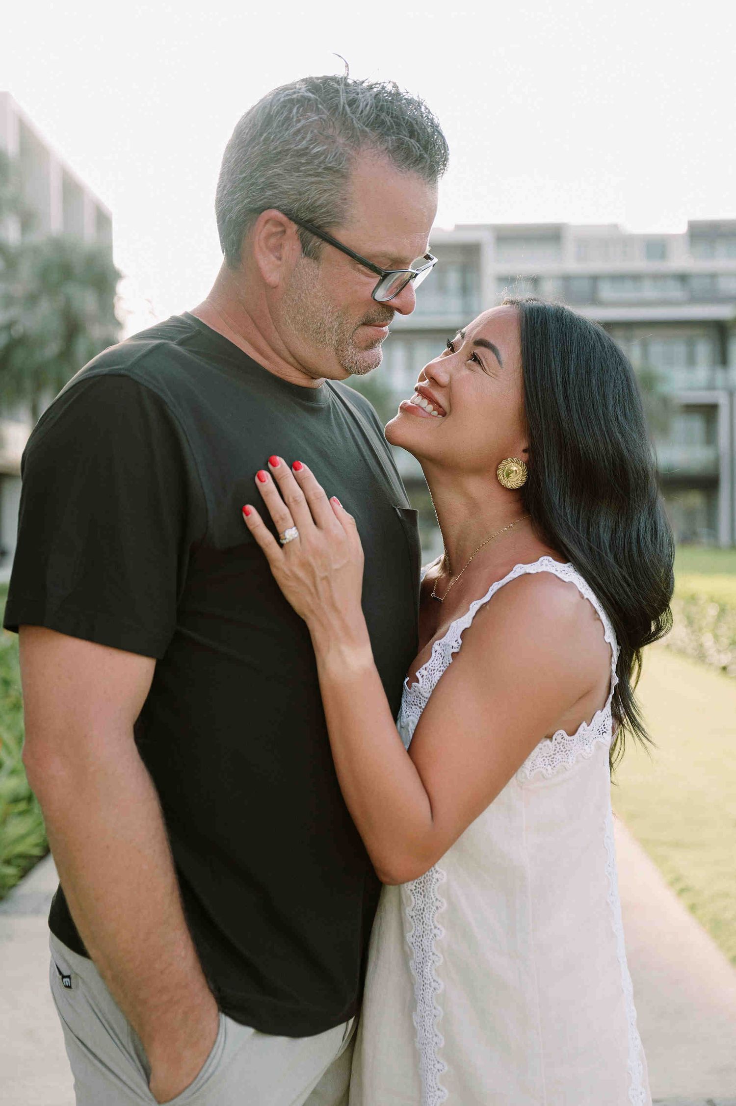 Da Nang family: romantic couple shares tender moments against a soft natural background, by AnhVuWedding.