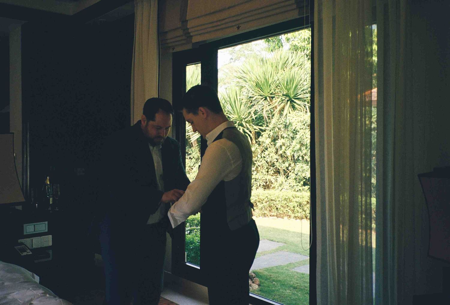 Lang Co wedding: interior view of a venue with large windows showing natural landscape outside, by AnhVuWedding.