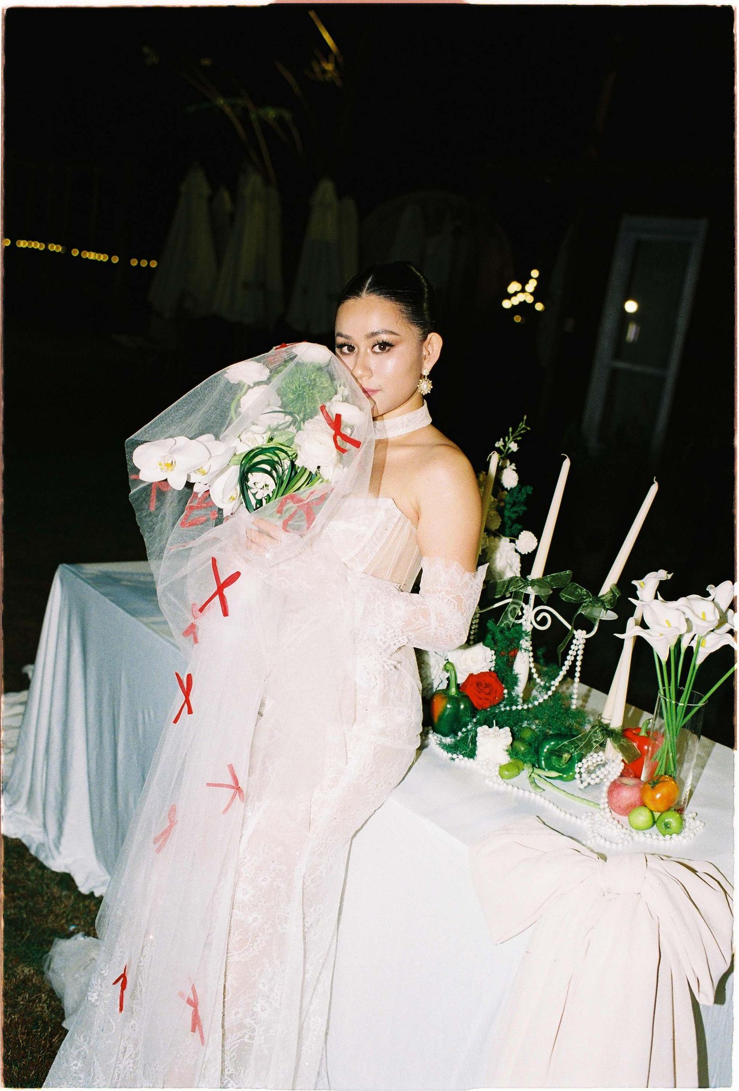 Saigon pre-wedding: wedding scene with elegant table decorations, white calla lilies, and candles at night, by AnhVuWedding.