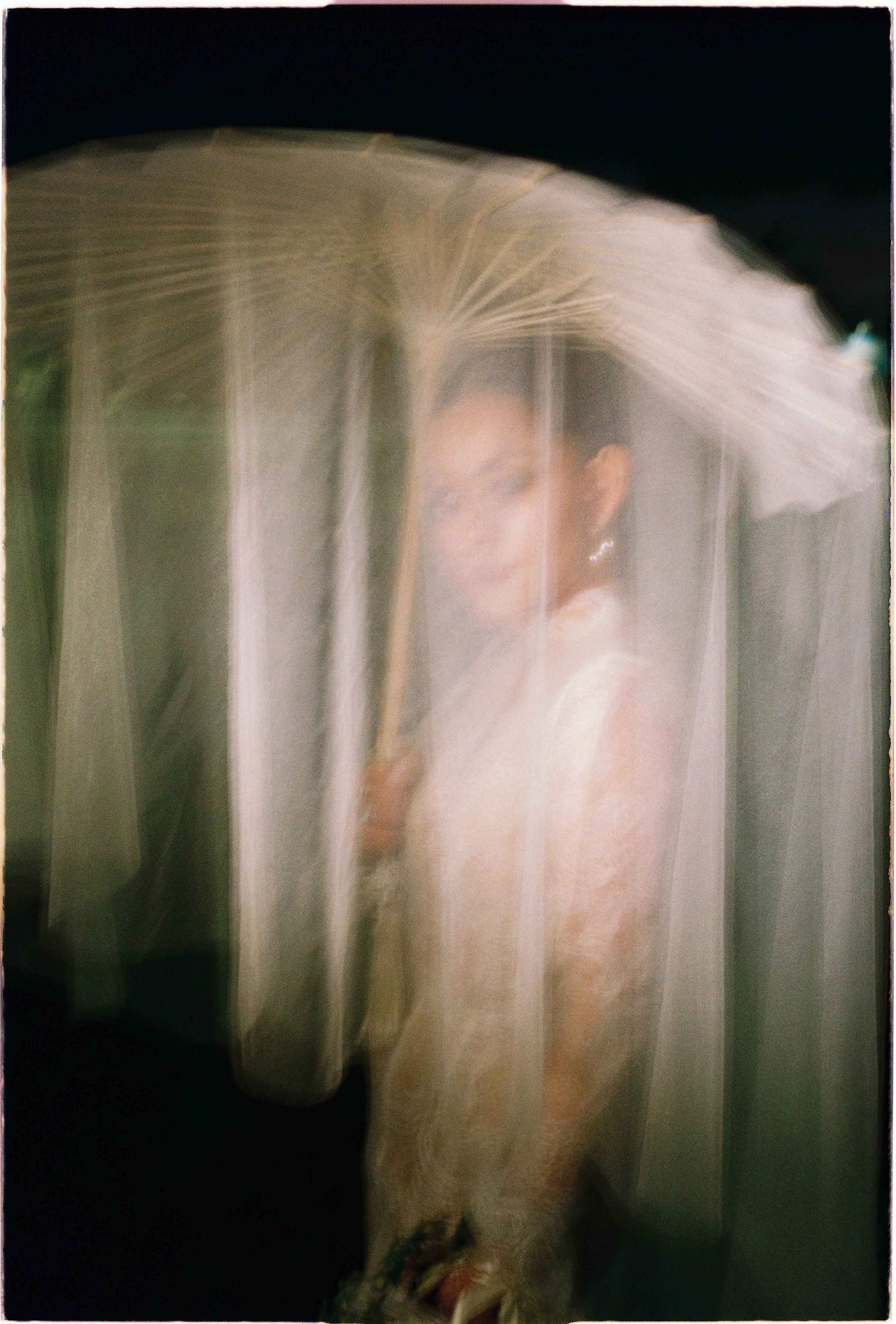 Saigon pre-wedding: ethereal motion blur photography of a white dress and veil creating a dreamy effect, by AnhVuWedding.