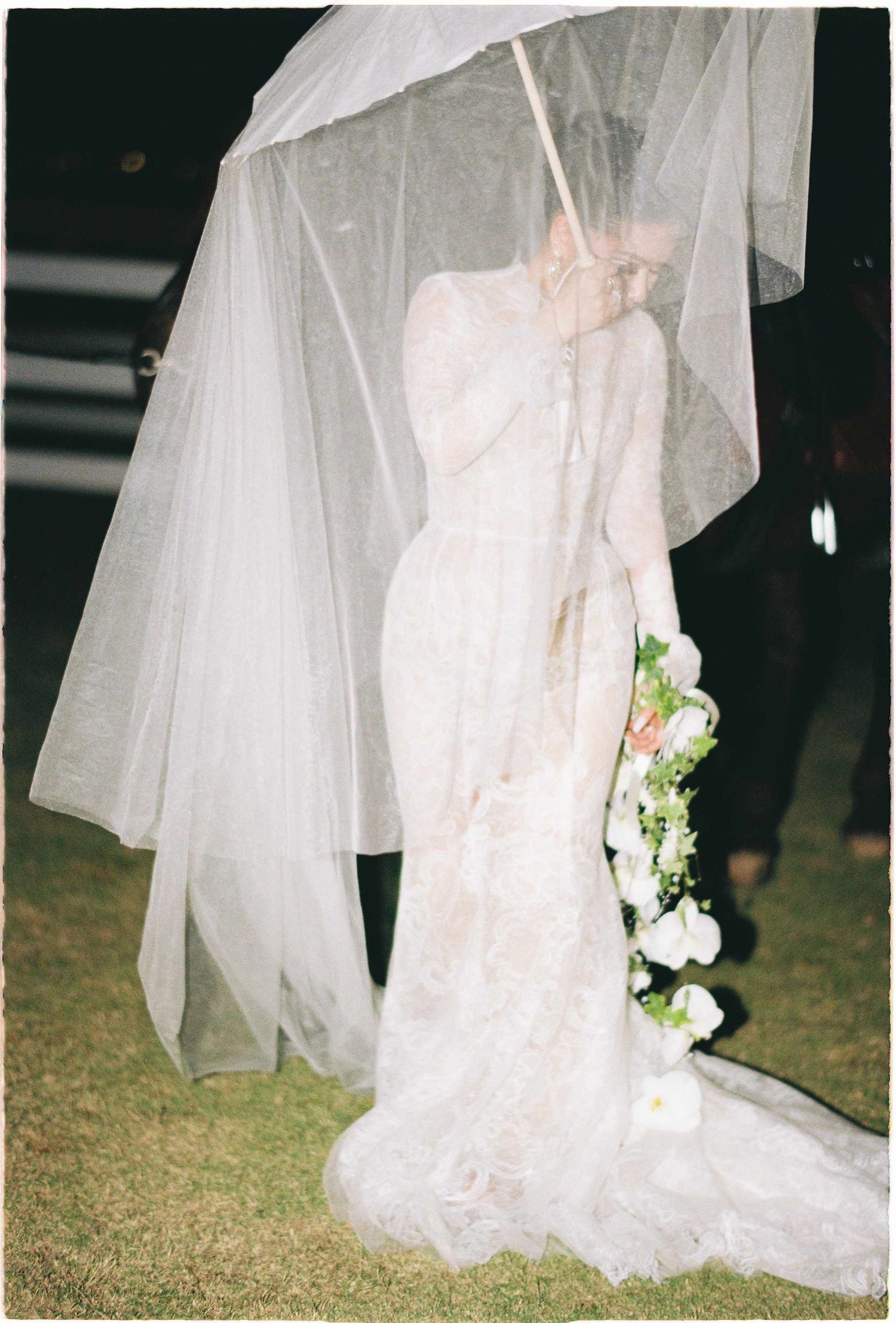 Saigon pre-wedding: flowing white wedding dress and veil details captured in an artistic composition, by AnhVuWedding.