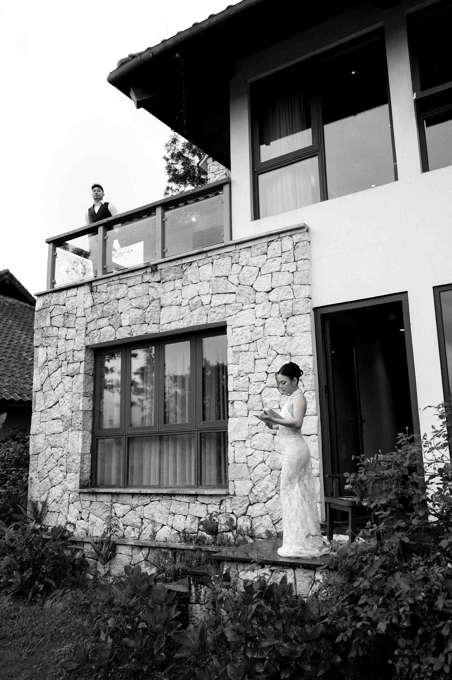 wedding: rustic mountain house featuring stone walls and large windows with a scenic mountain backdrop, by AnhVuWedding.