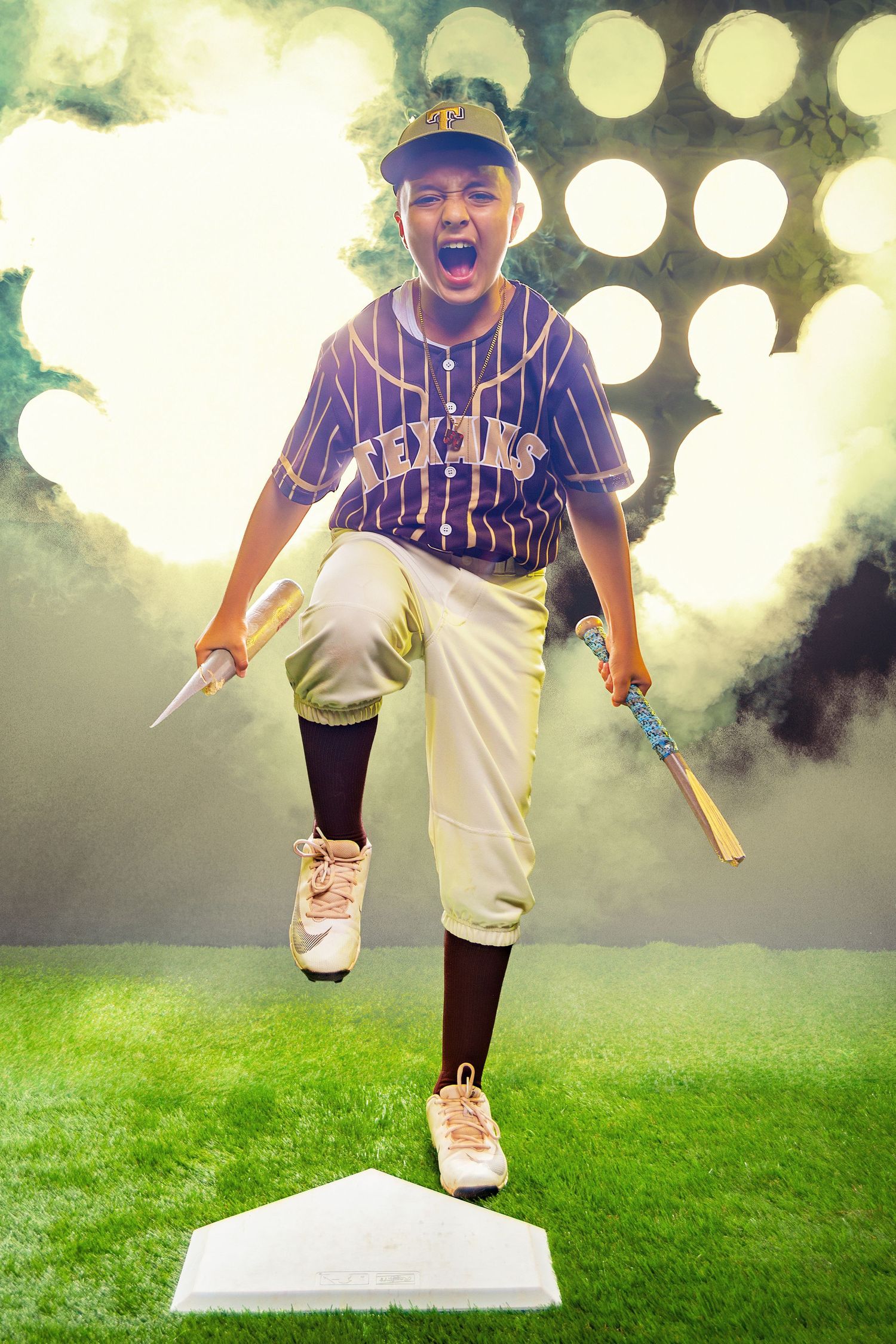 Young boy in Texans baseball uniform jumping on home plate with bat, stadium lights and smoke in background.
