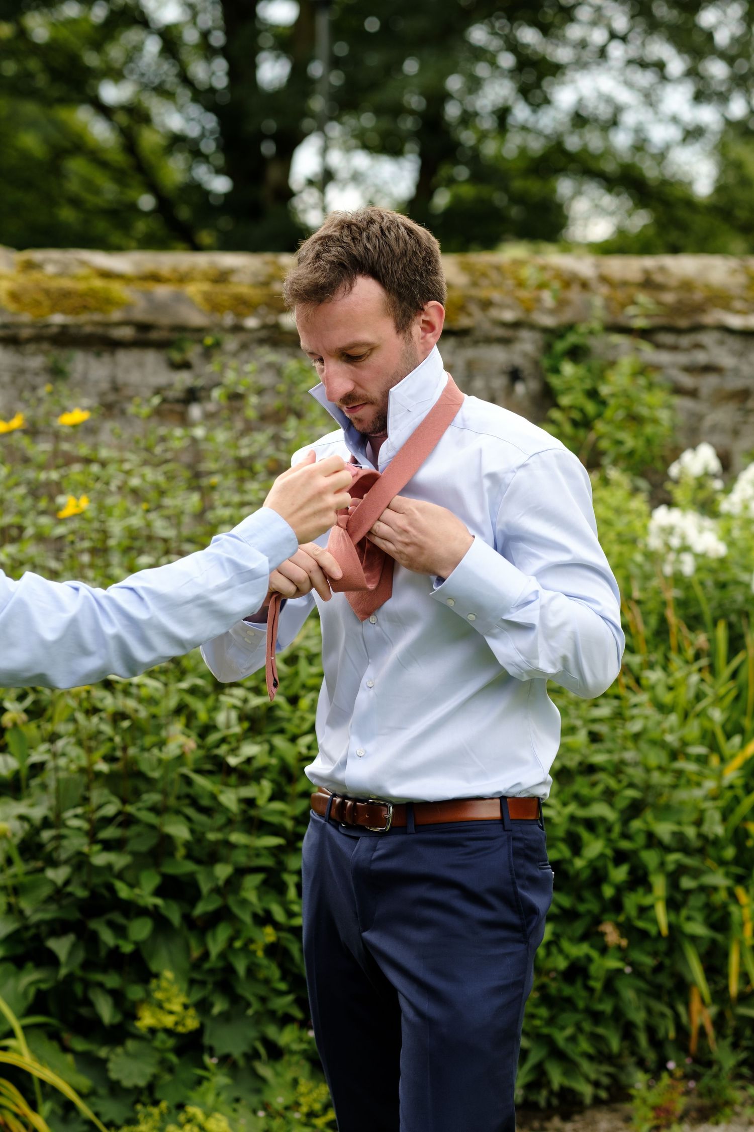 Groom preparation images by Norfolk and Norwich wedding photographer covering Norfolk, Suffolk, Cambridgeshire, and throughout the UK.