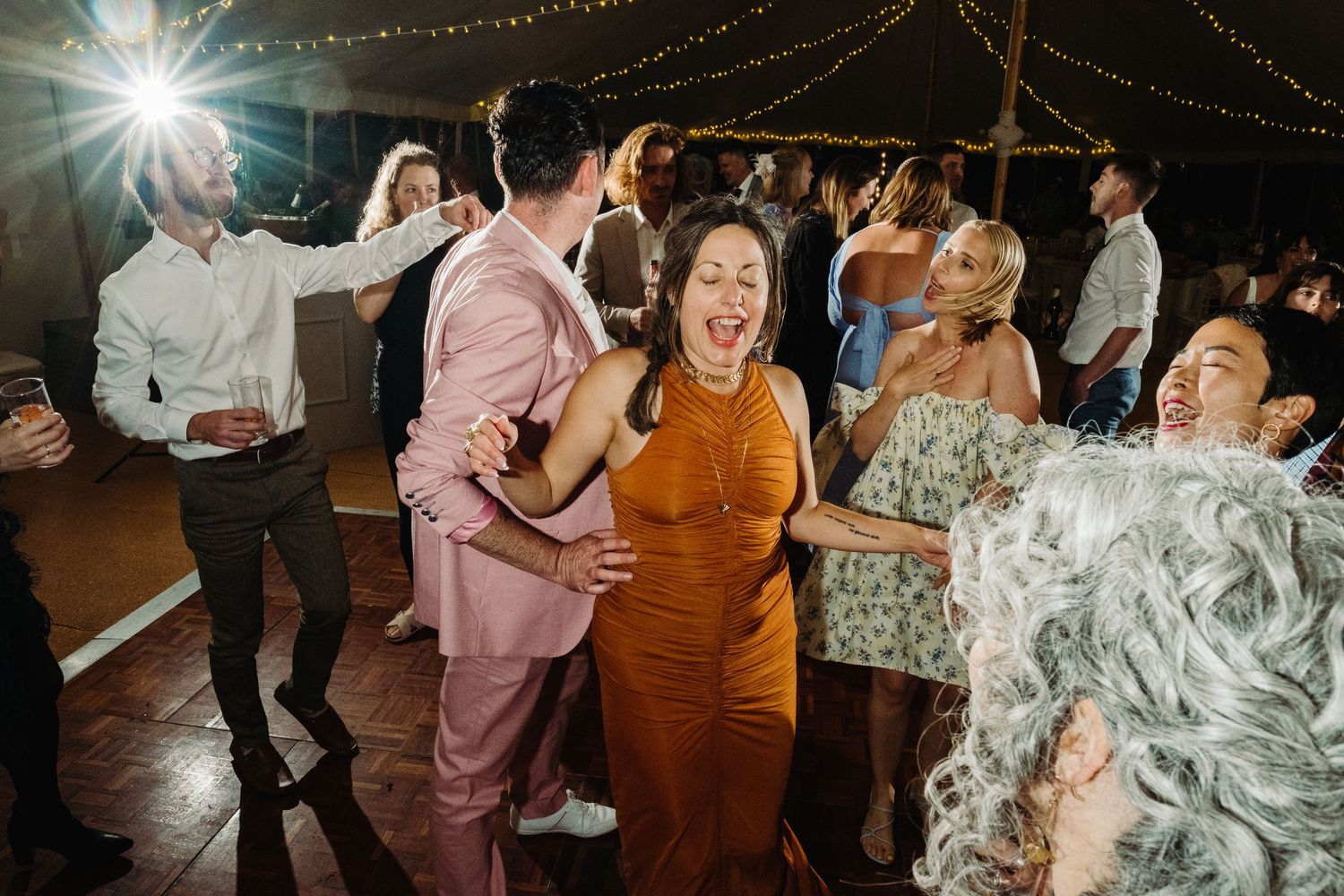 Wedding reception dancing by Norfolk wedding photographer covering Norfolk, Norwich, Suffolk, Cambridgeshire and throughout the UK.
