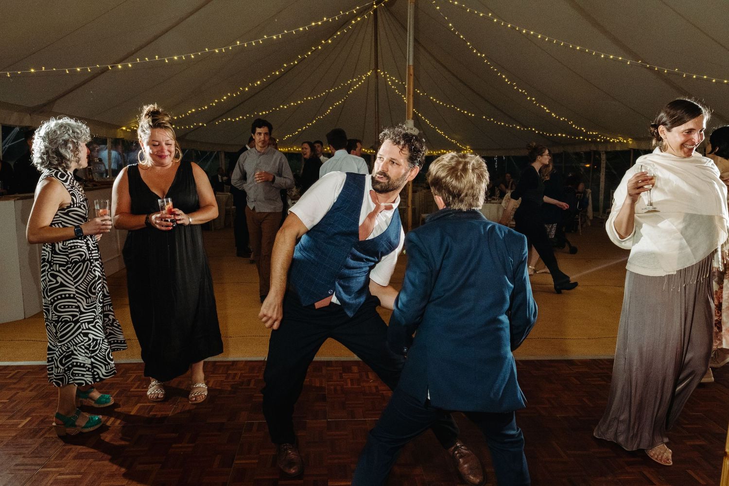Wedding reception dancing by Norfolk wedding photographer covering Norfolk, Norwich, Suffolk, Cambridgeshire and throughout the UK.