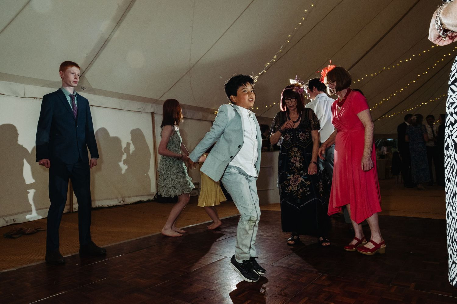 Wedding reception dancing by Norfolk wedding photographer covering Norfolk, Norwich, Suffolk, Cambridgeshire and throughout the UK.